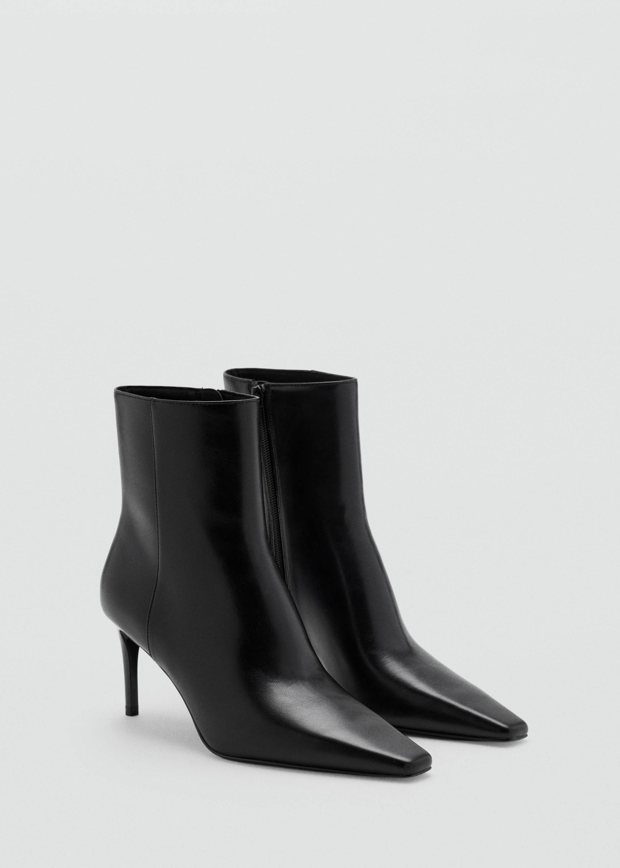 Black ankle boots with a pointed square toe and stiletto heel.