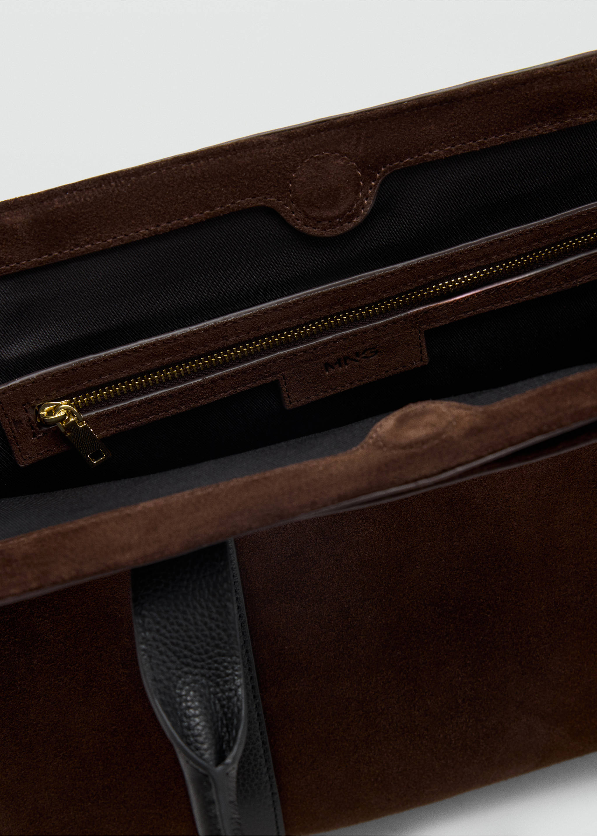 Dark brown suede City bag detail showing the interior, zippered pocket, and brand label., Chocolate. Ref: 47011356-00.