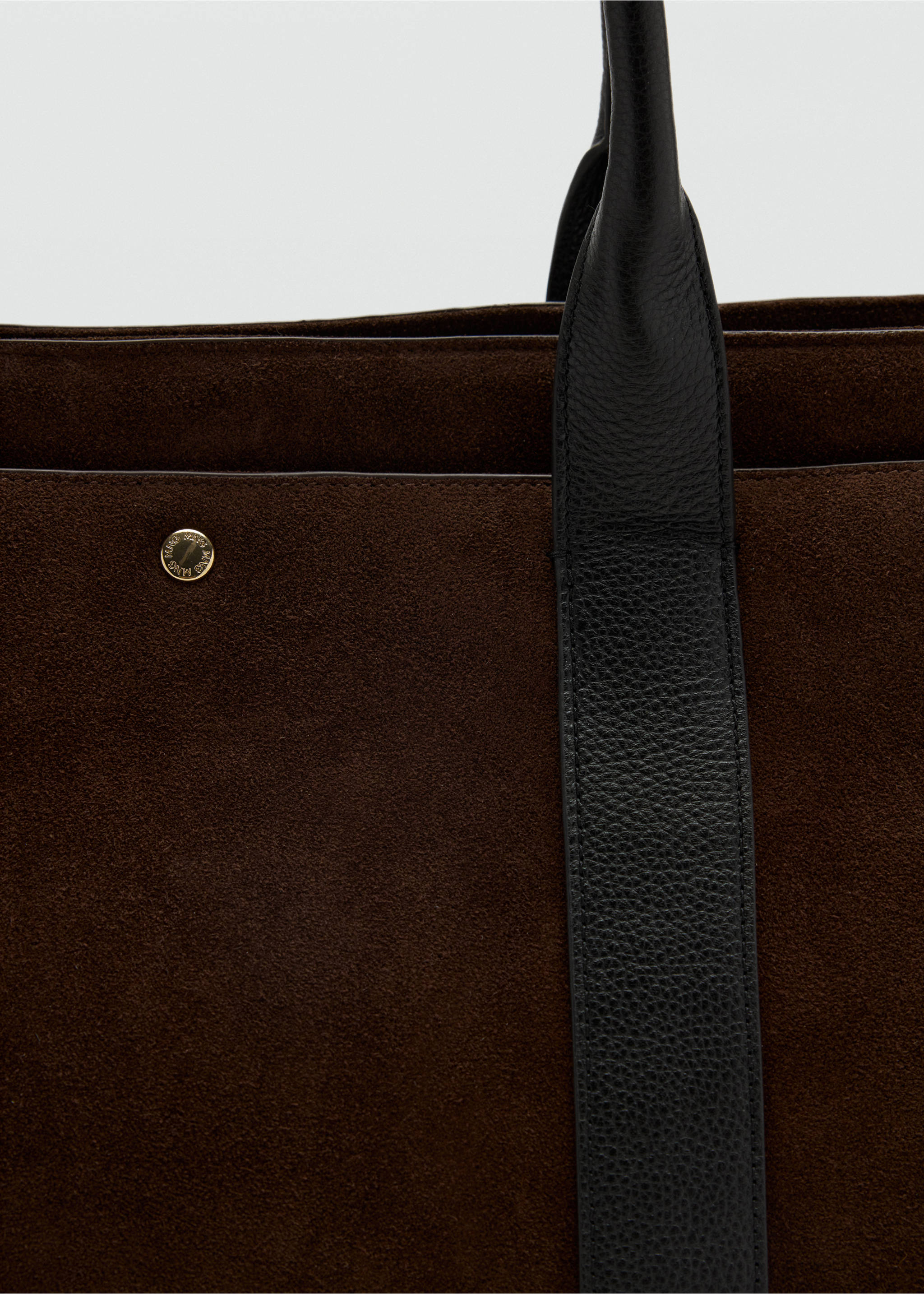 Close-up of a dark brown suede city bag with black leather handles., Chocolate. Ref: 47011357-00.