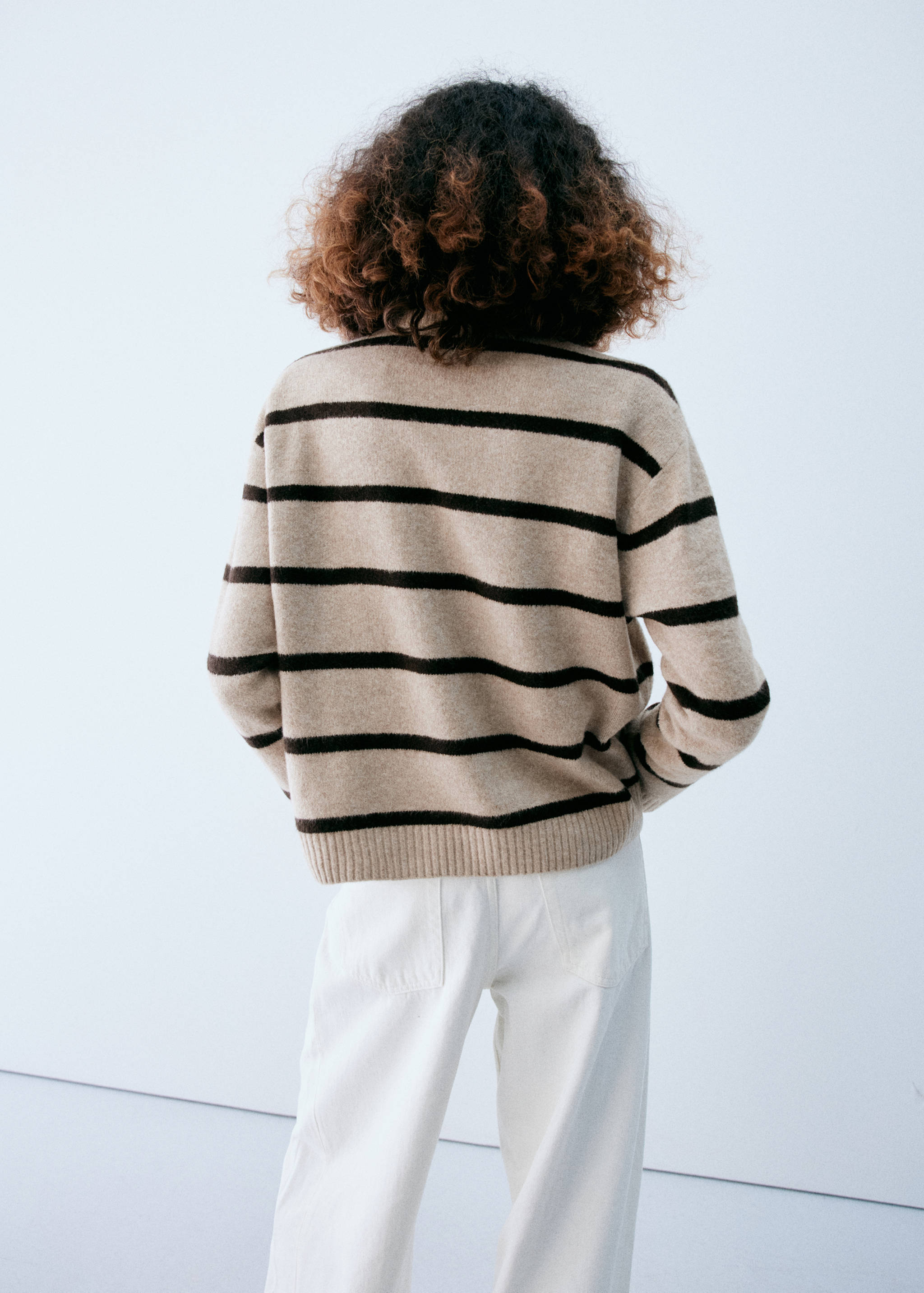 Beige and dark brown striped knit jersey, back view.