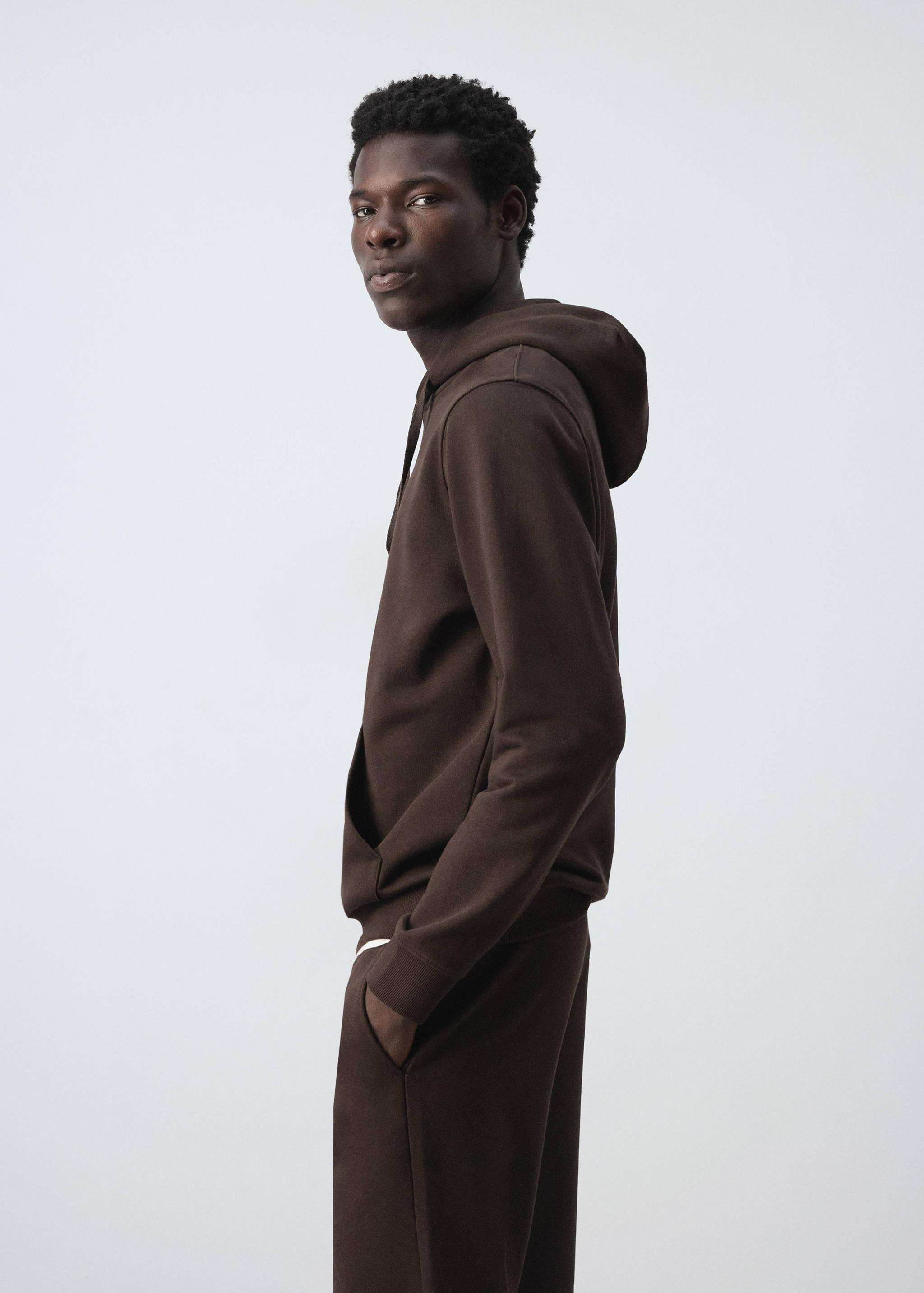 Dark brown hoodie with a hood, drawstrings, and a front pocket.