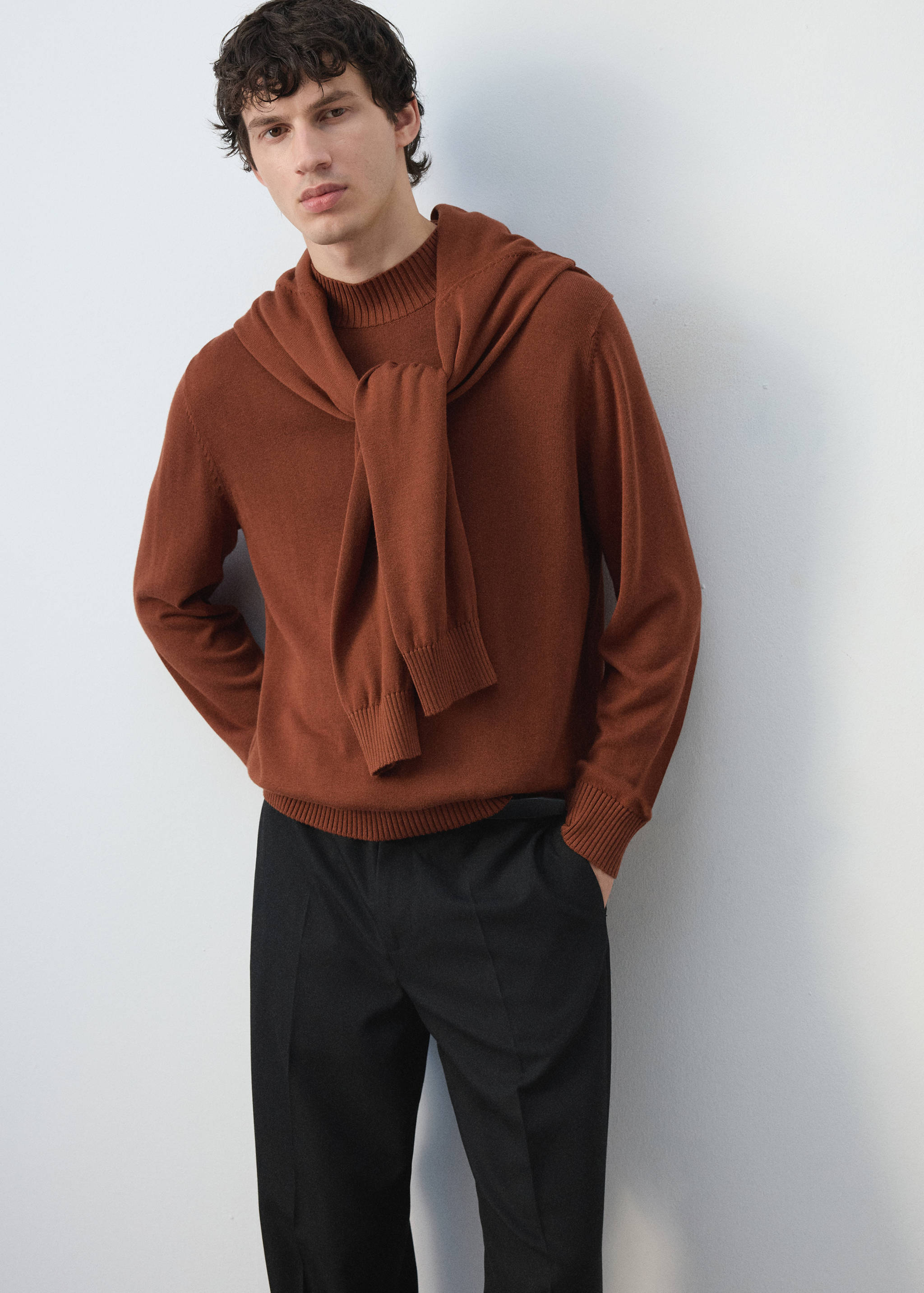 Brown knit jersey with ribbed mock neckline, styled with a matching jersey tied over the shoulders.