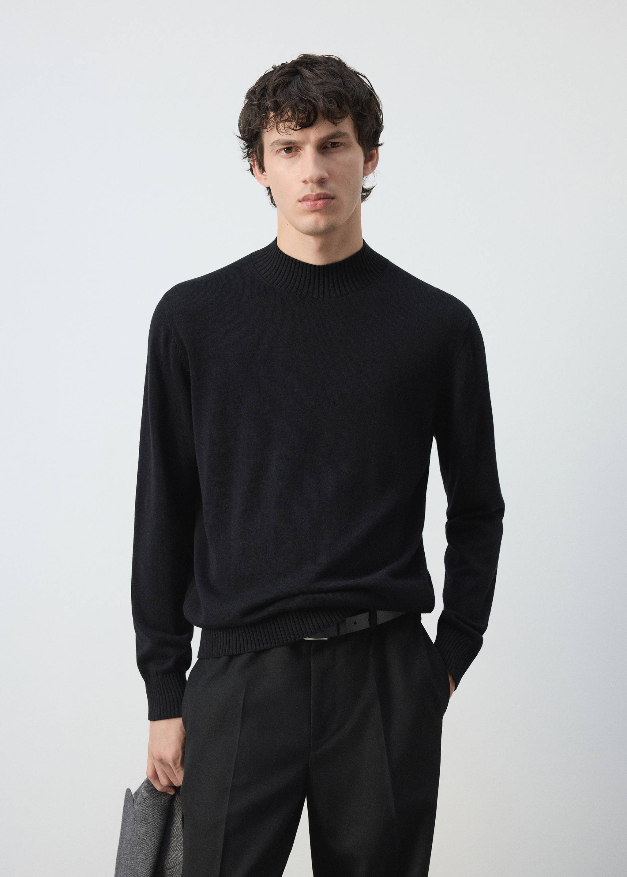 Black fine-knit mock-neck jersey with long sleeves.