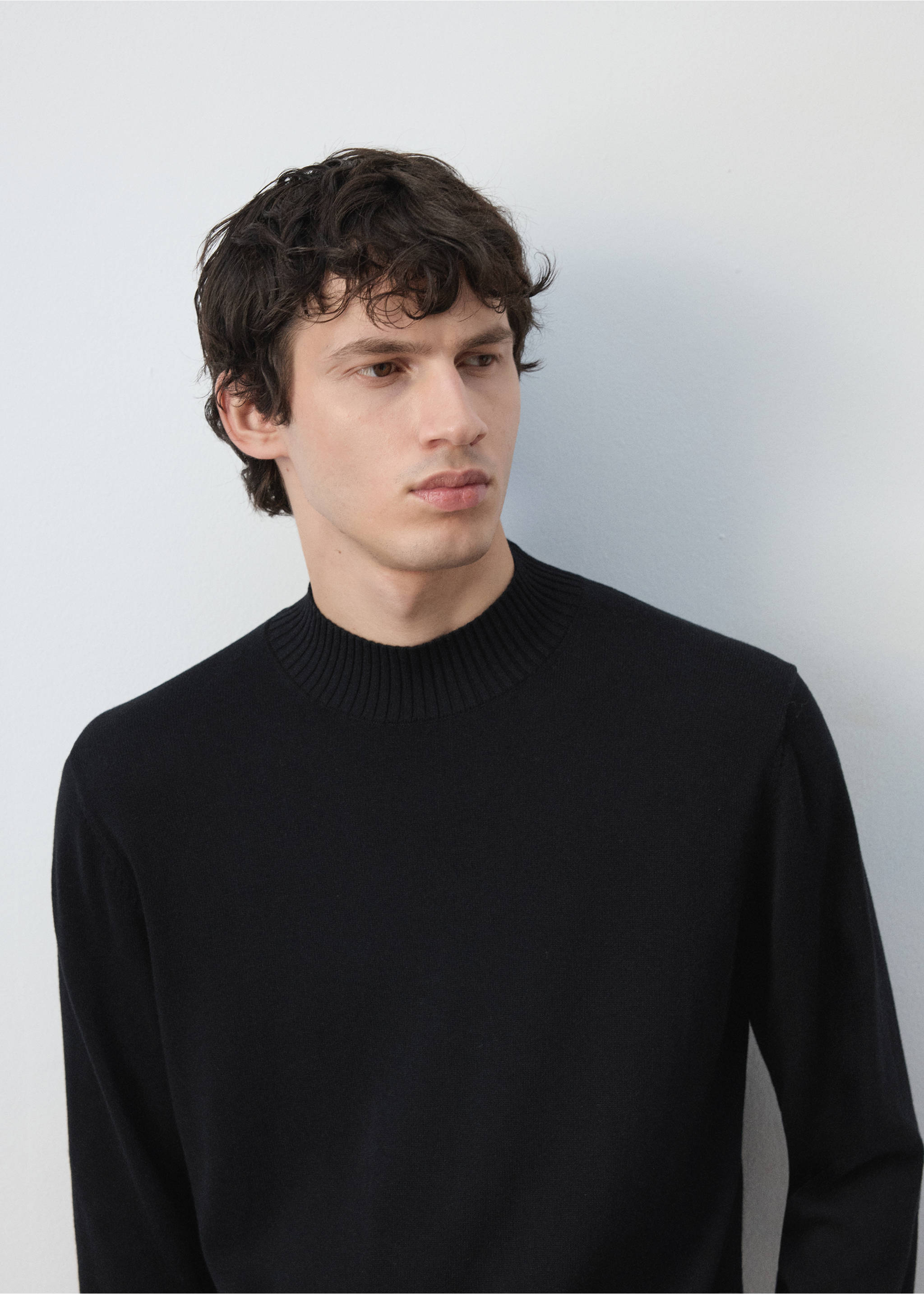 Black knit jersey with a ribbed mock neckline., Black. Ref: 47021335-00.