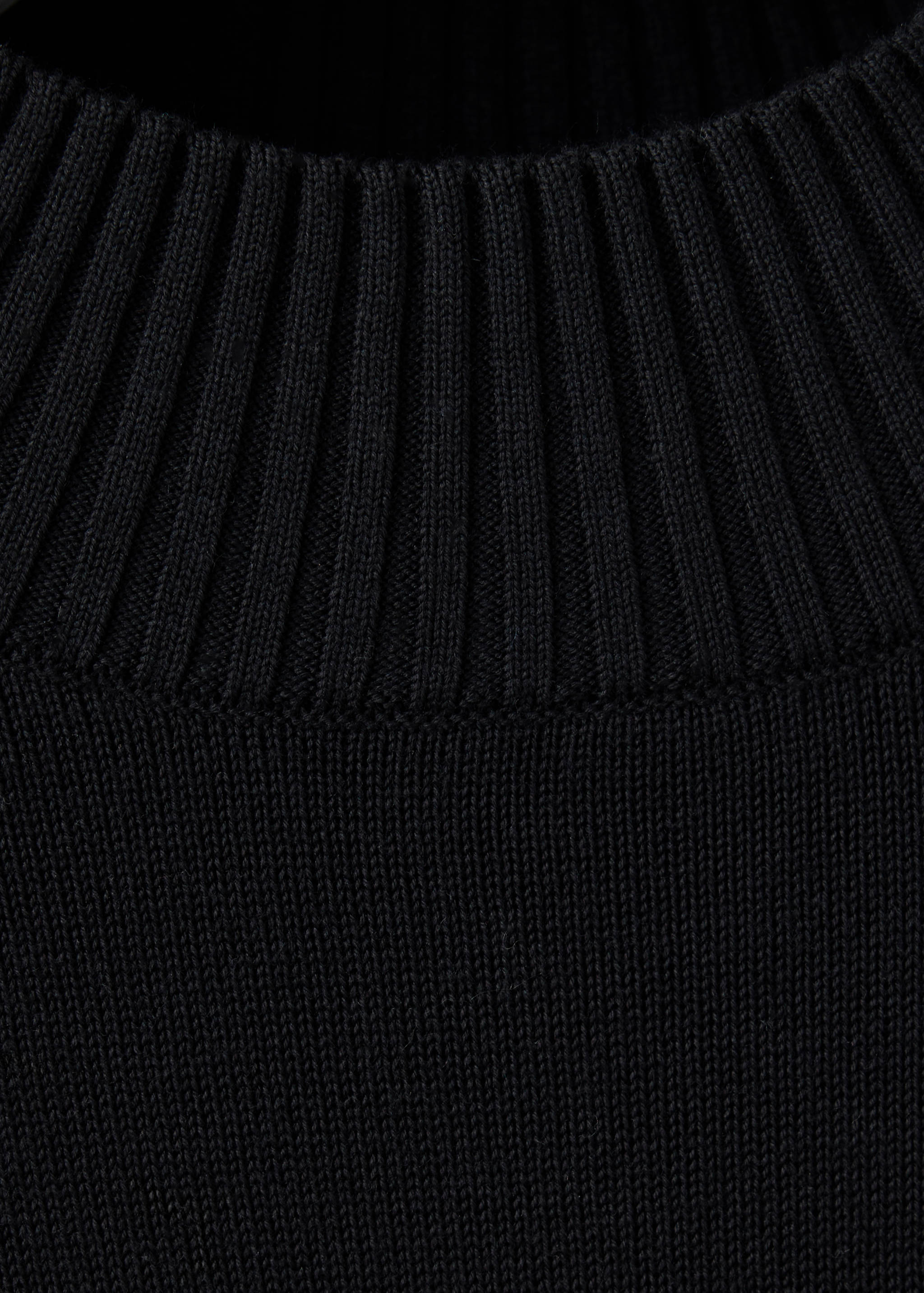 Black men's jersey featuring a ribbed mock neck and fine-knit texture.