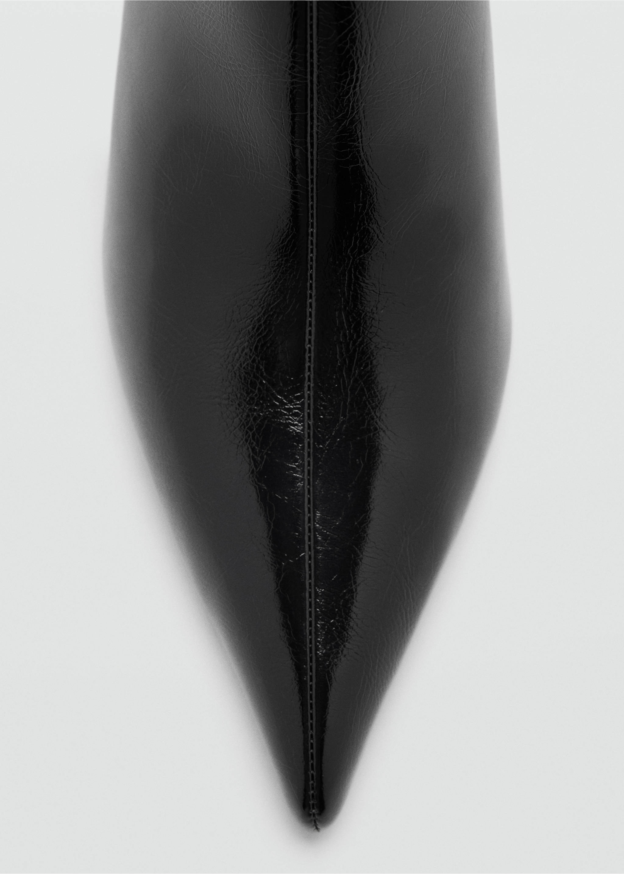 Close-up of a black patent ankle boot with a pointed toe., Black. Ref: 47021337-00.