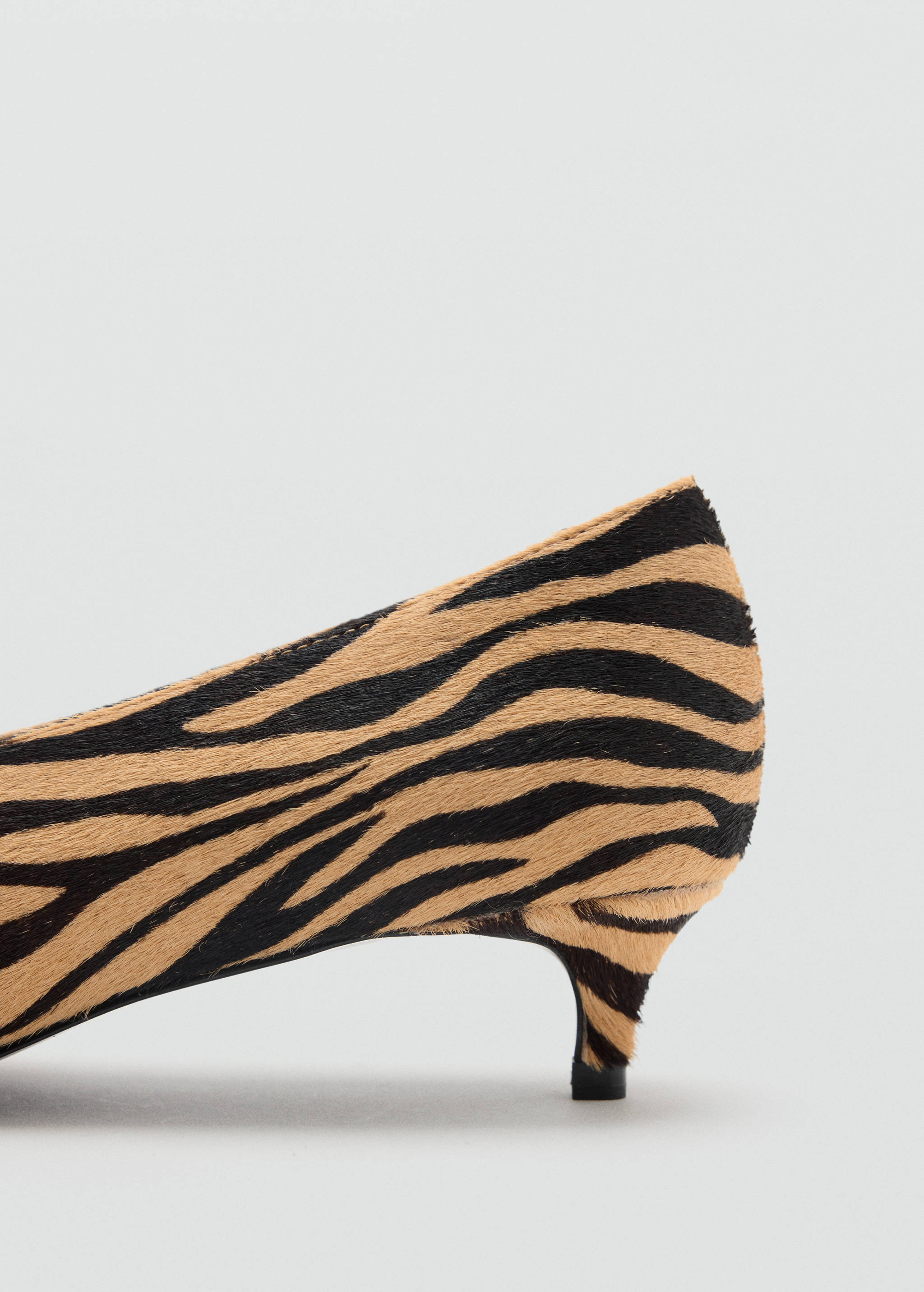 Zebra-print faux-hair shoe detail with a low kitten heel.