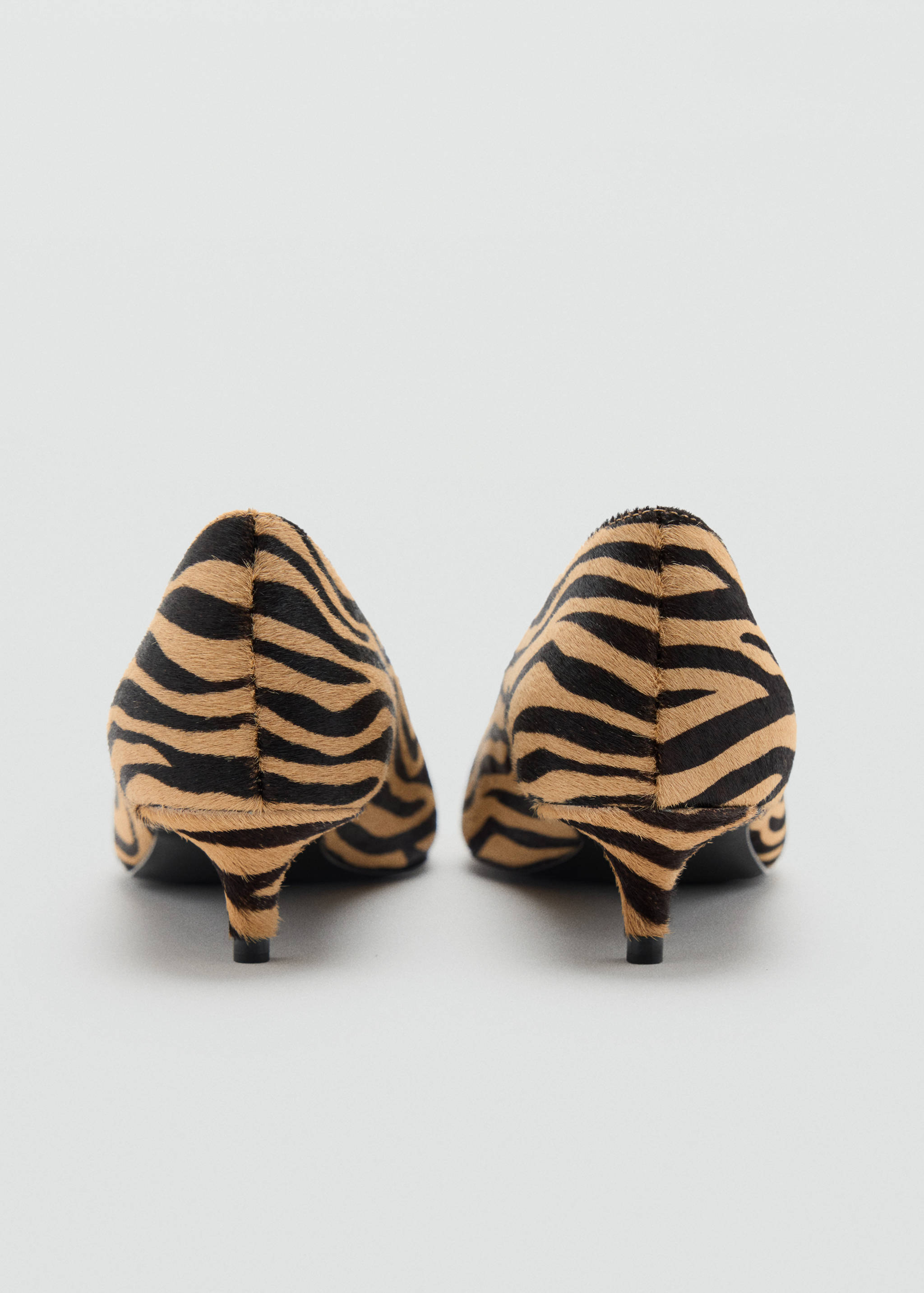 Animal print shoes with kitten heels and pointed toes, back view.
