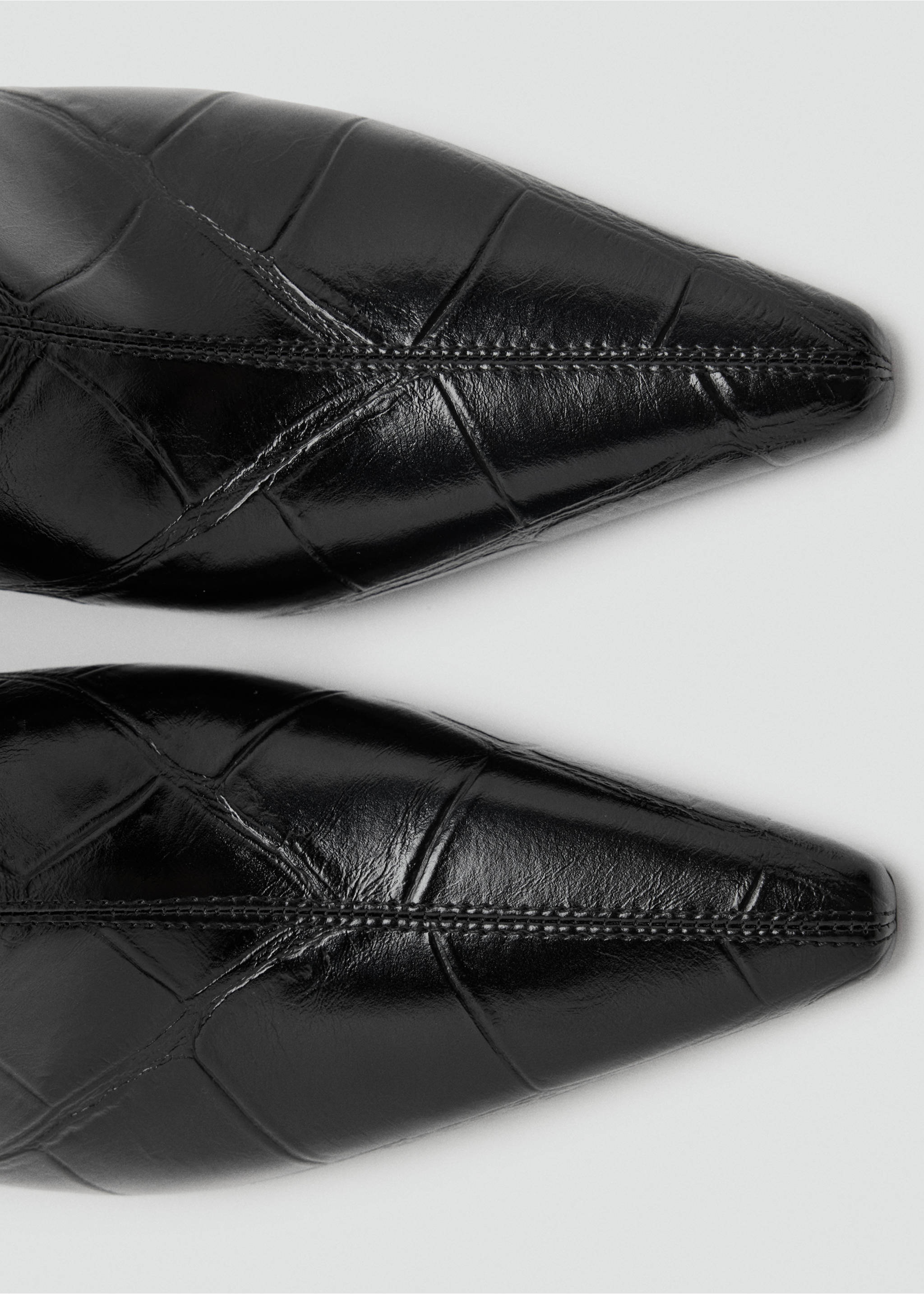 Close-up of black glossy crocodile-embossed pointed ankle boots., Black. Ref: 47021352-00.
