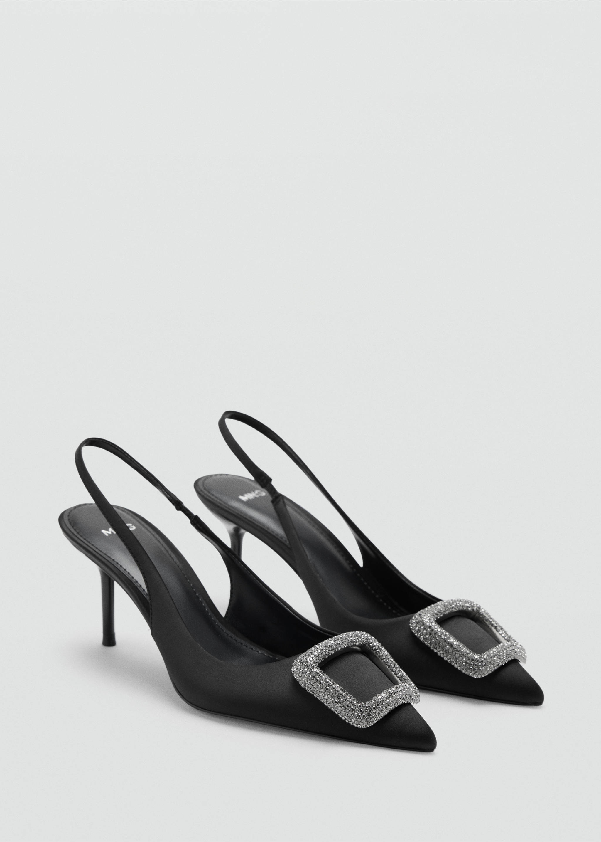Black heeled slingback shoes with pointed toes and rhinestone buckles., Black. Ref: 47021353-00.