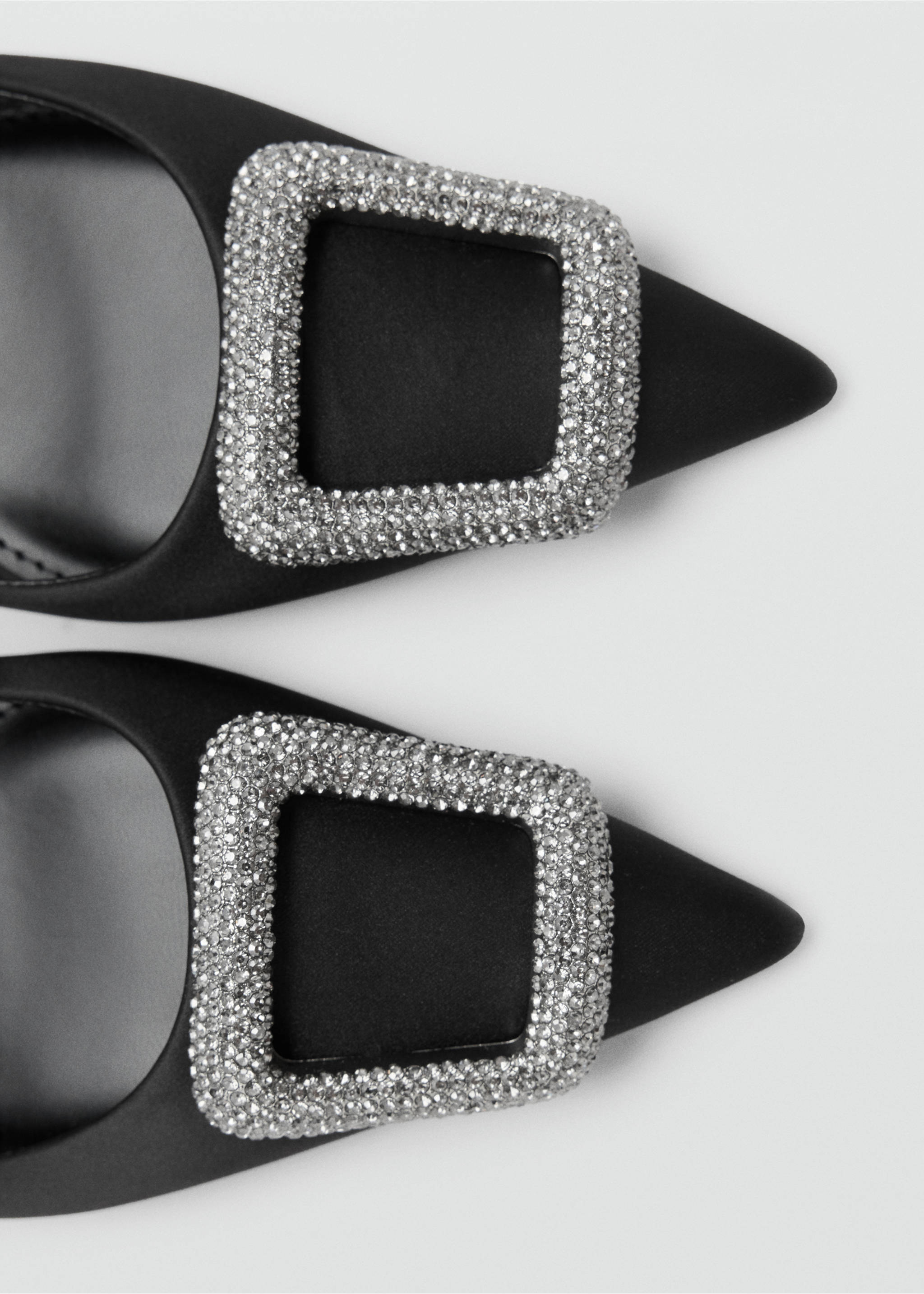 Close-up of black satin shoes with crystal buckle detail., Black. Ref: 47021353-00.