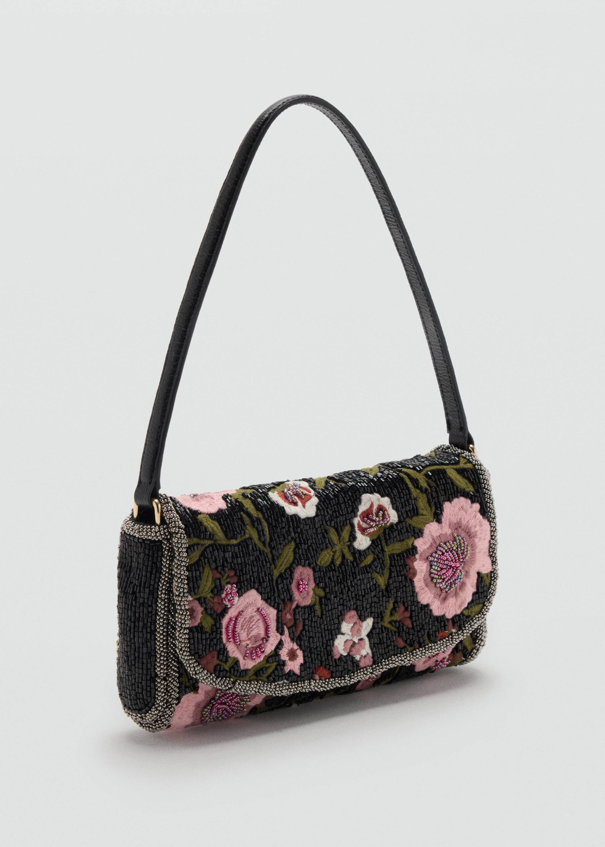Black beaded shoulder bag with a floral pattern and narrow strap.