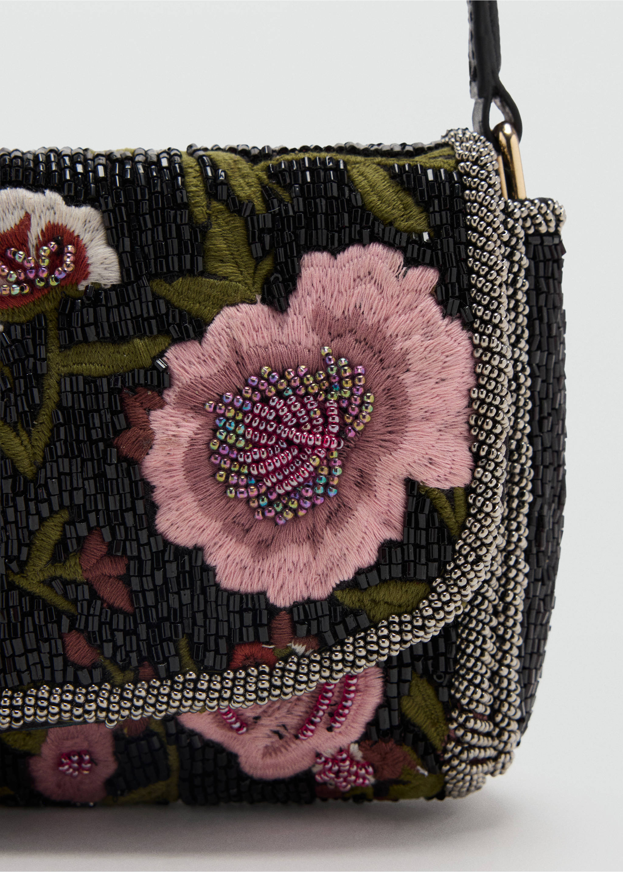 Close-up of a beaded shoulder bag with pink floral embroidery and silver-beaded trim., Black. Ref: 47021354-00.