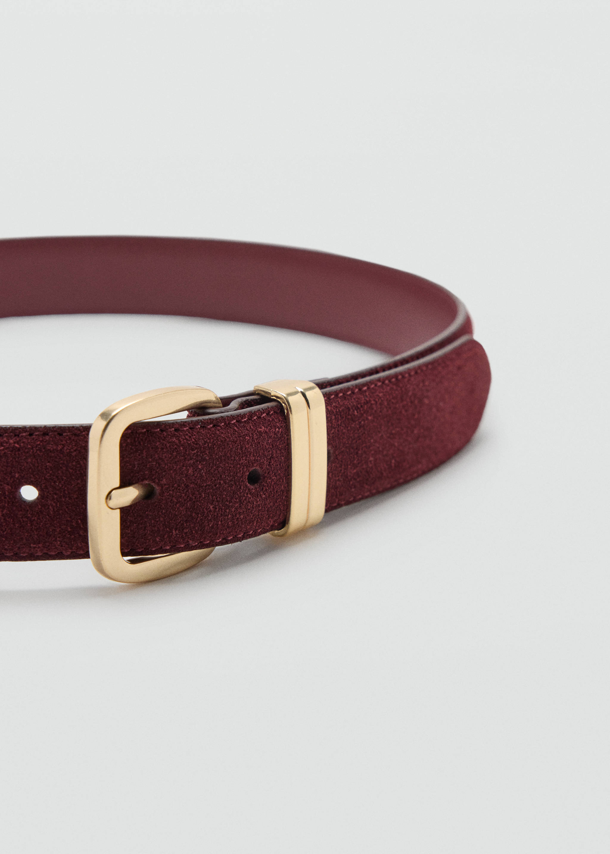 Burgundy suede belt featuring a polished gold-toned metal buckle.