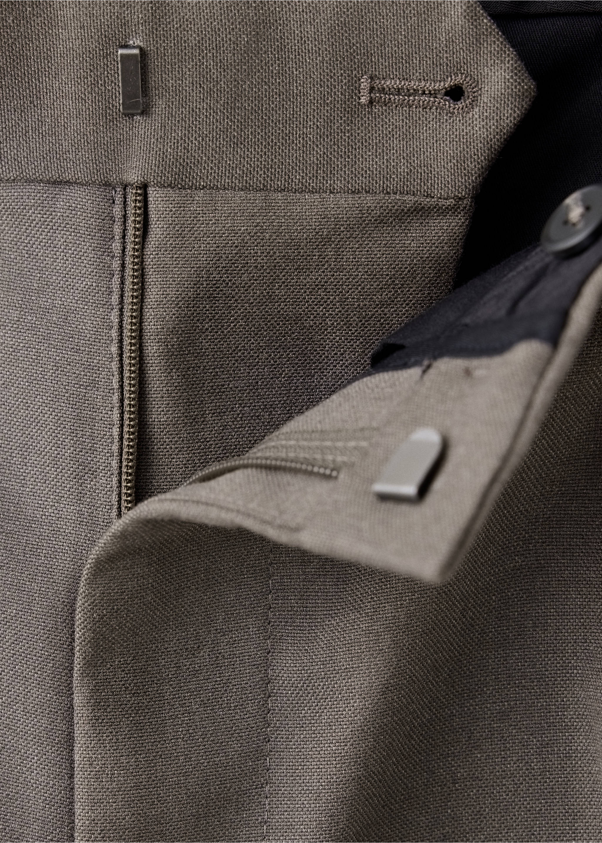 Close-up of taupe textured trousers showing waistband and fastening., Medium Brown. Ref: 47031324-00.
