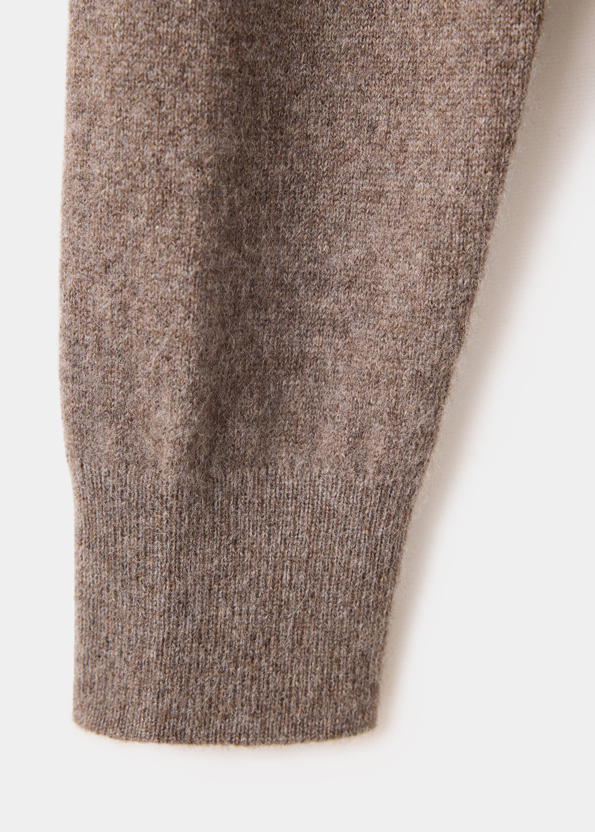 Brown knitted jersey fabric and ribbed cuff detail