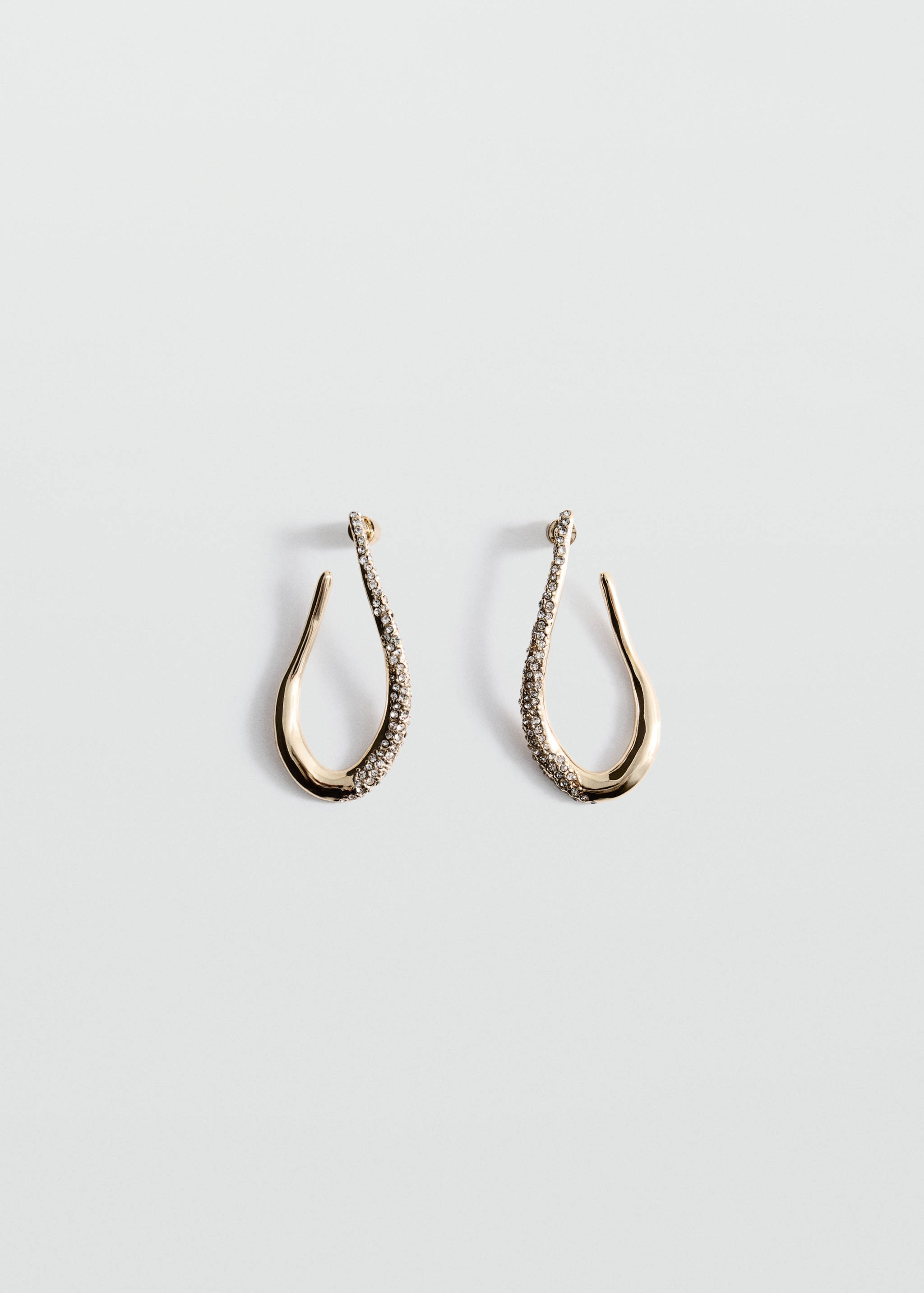 Gold-toned asymmetric drop earrings with rhinestone embellishments.
