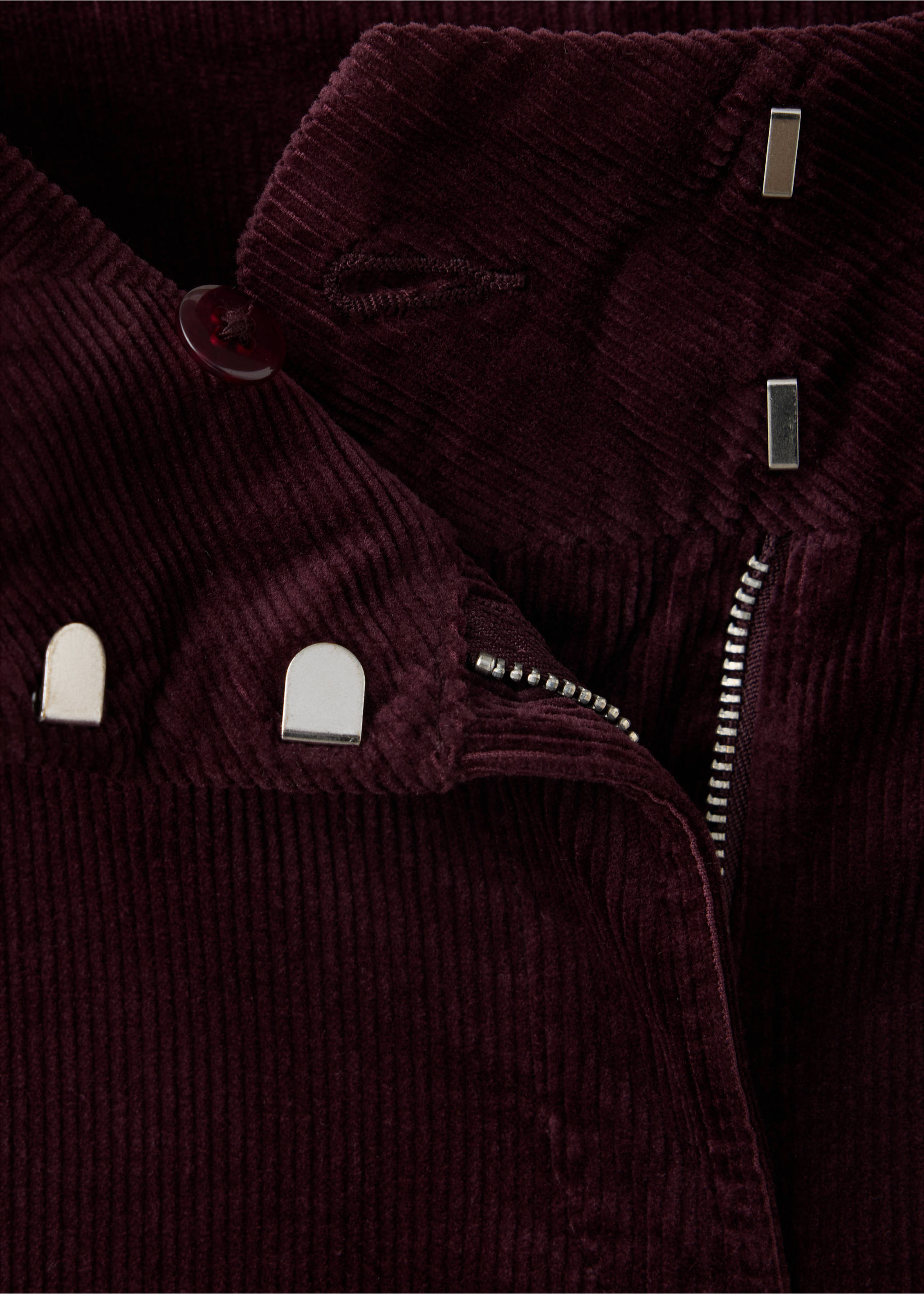 Close-up of deep burgundy corduroy trousers showing the waistband and zip detail., Wine. Ref: 47031428-00.