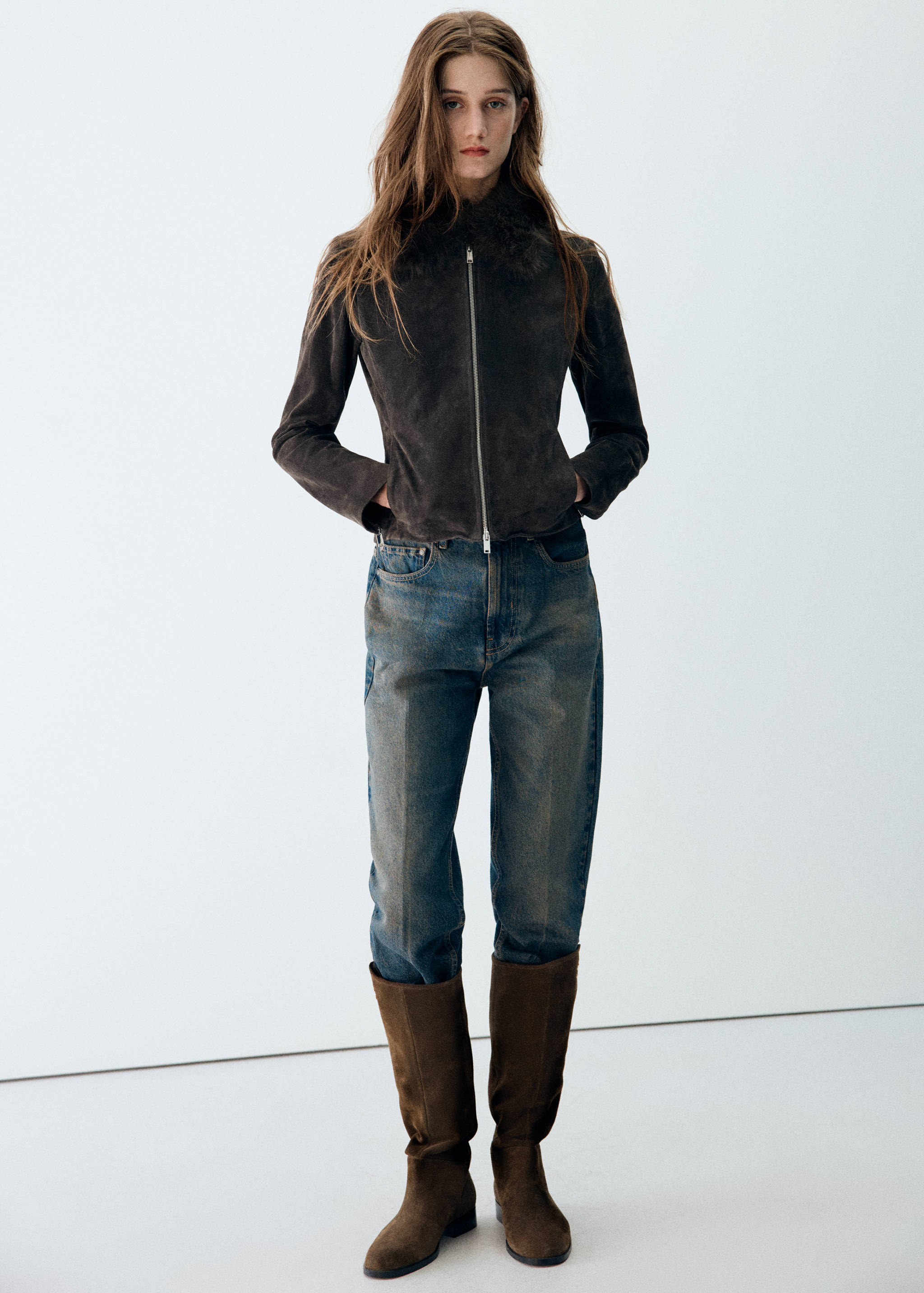 Brown suede tall boots with low block heels.
