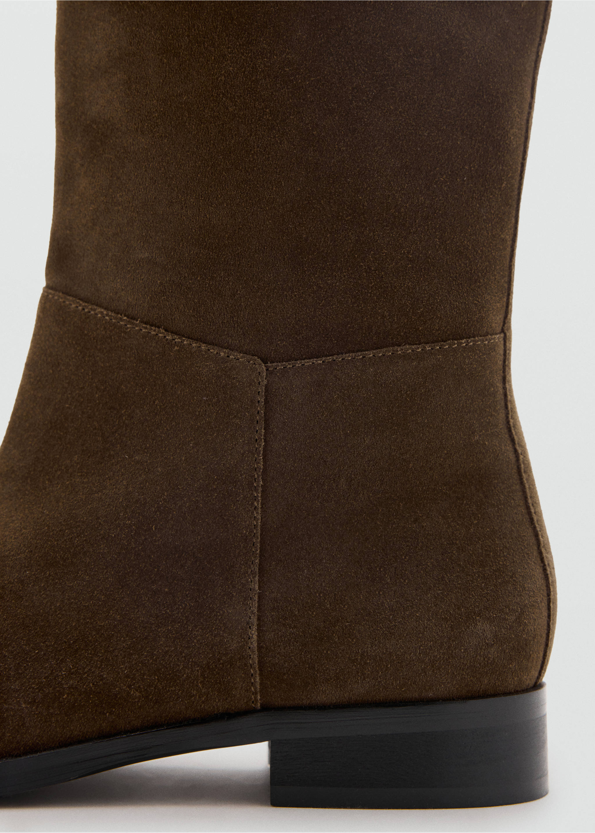 Close-up of a dark brown suede boot featuring tonal stitching and a low heel., Medium Brown. Ref: 47041337-00.