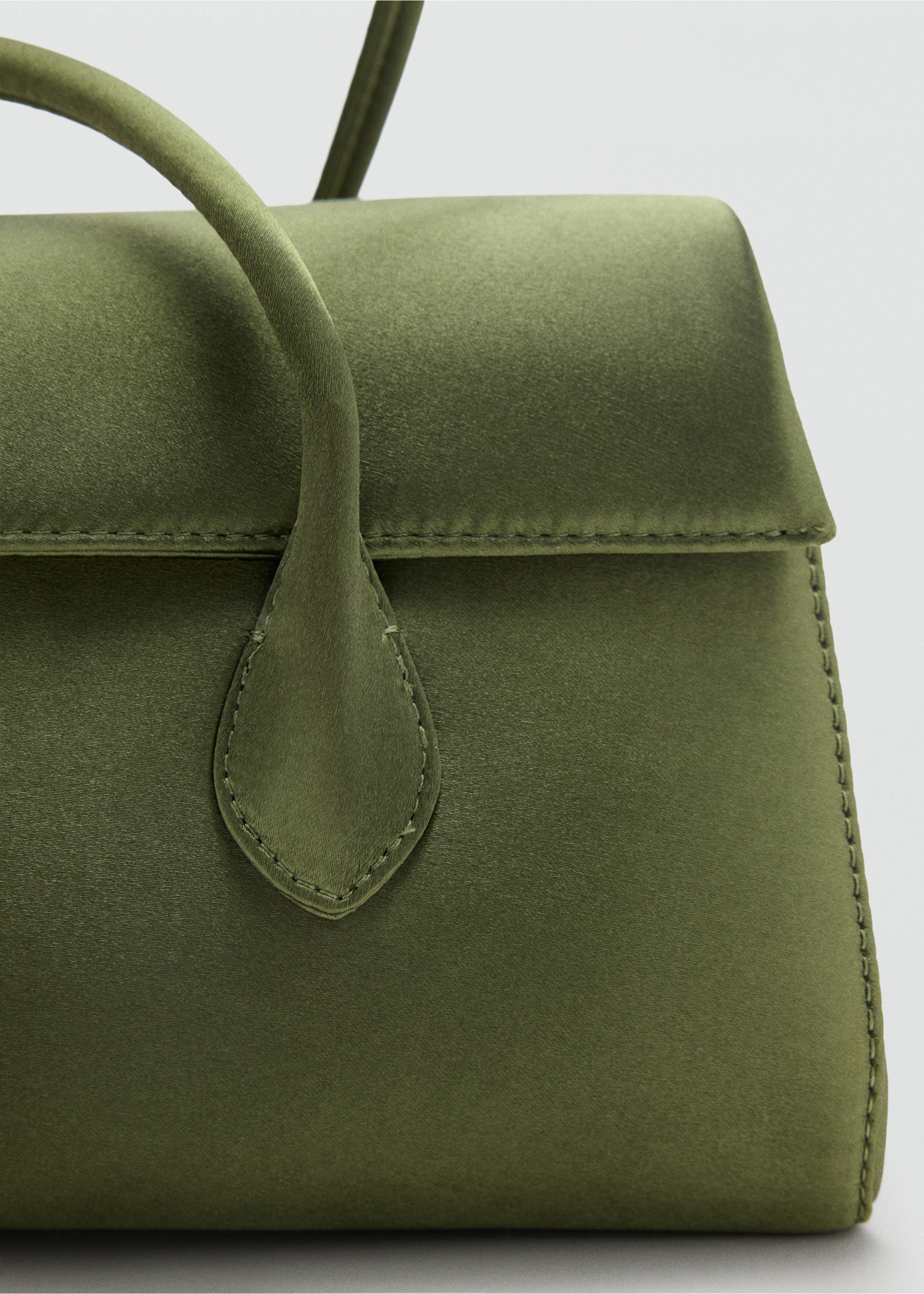 Olive green suede shoulder bag detail focusing on the flap and strap., Green. Ref: 47041346-00.