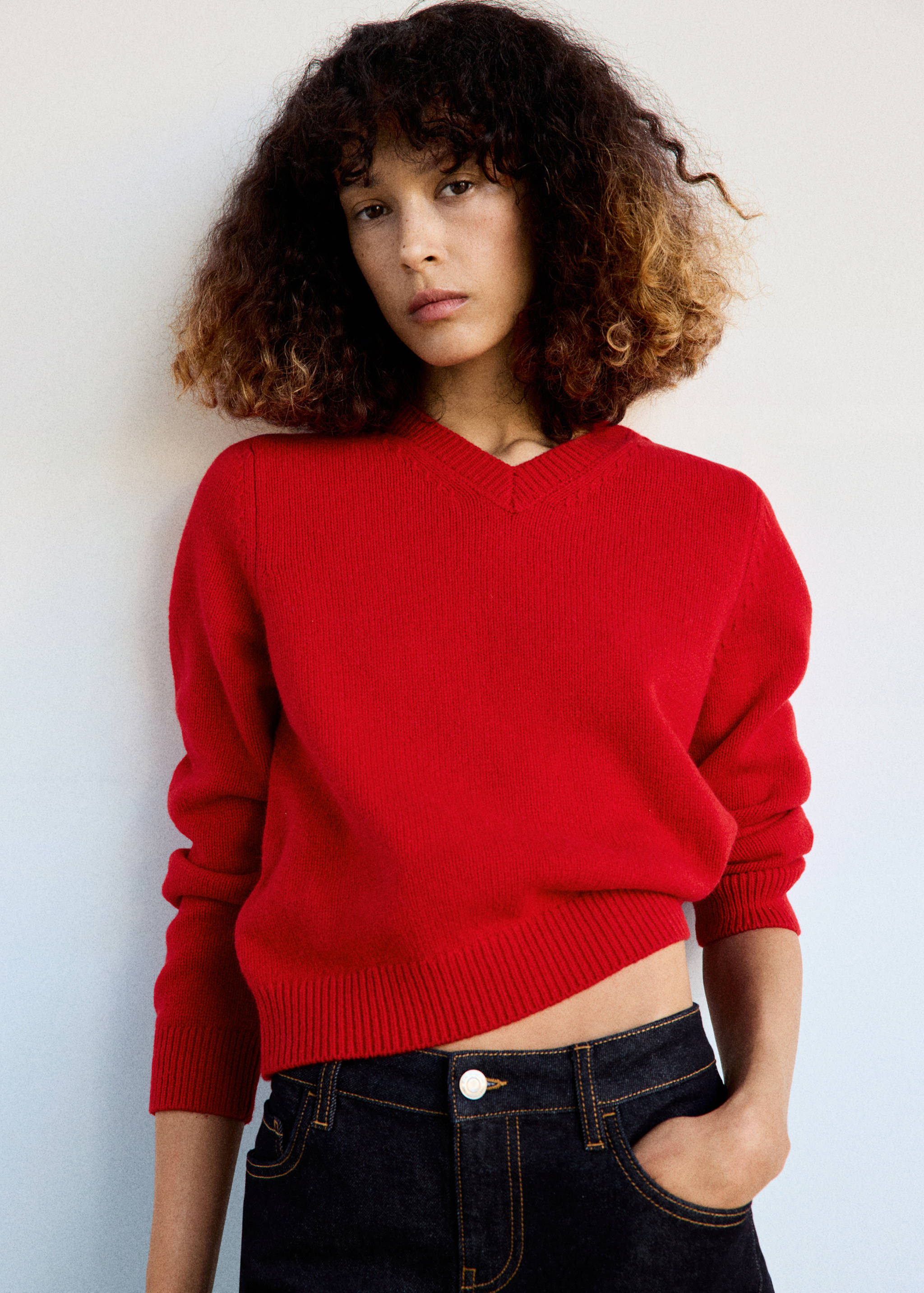 Vibrant red knitted V-neck jersey with ribbed trims and long sleeves.
