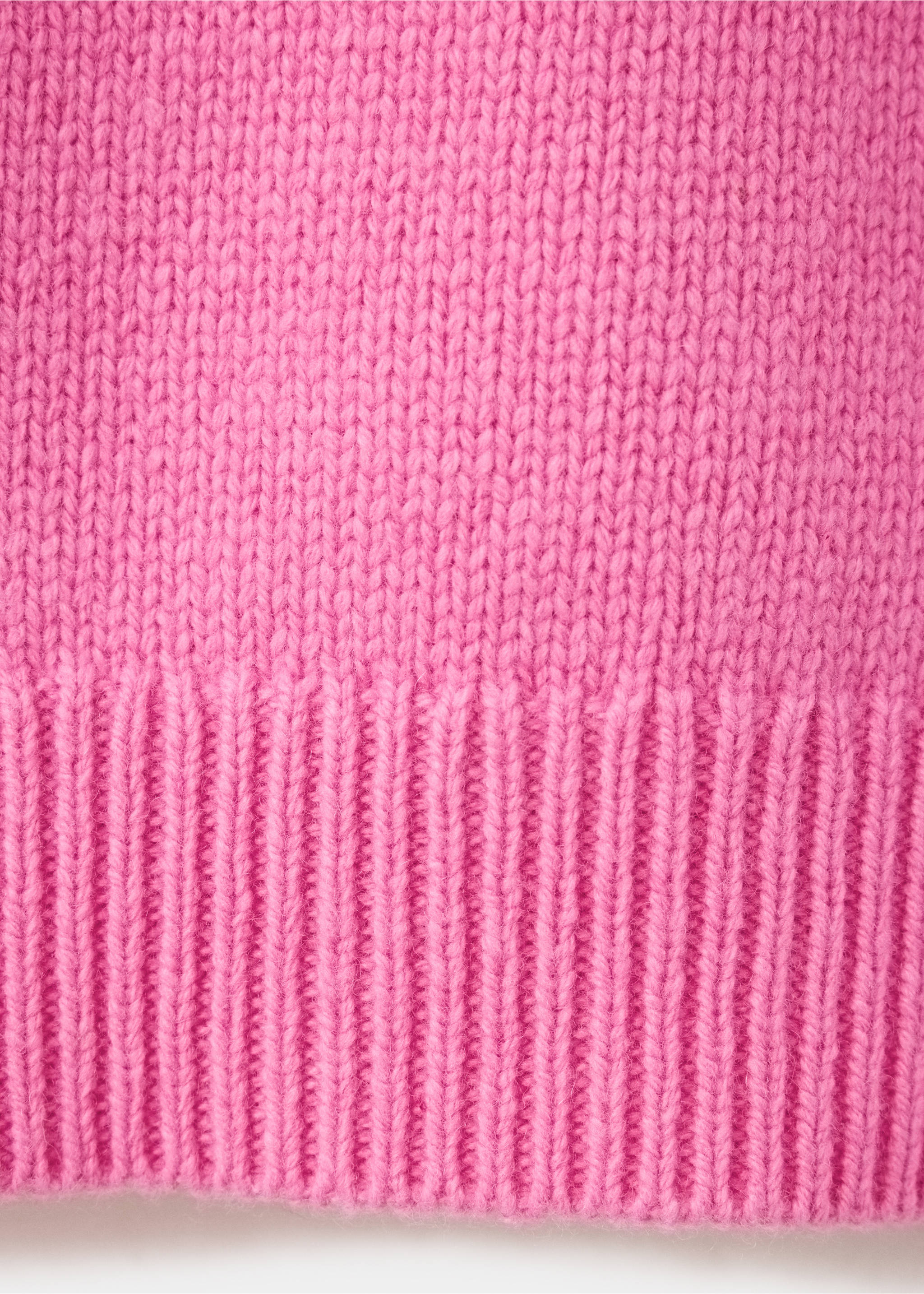 Pink jersey fabric detail showing knit texture and ribbed hem., Fuchsia. Ref: 47041362-00.