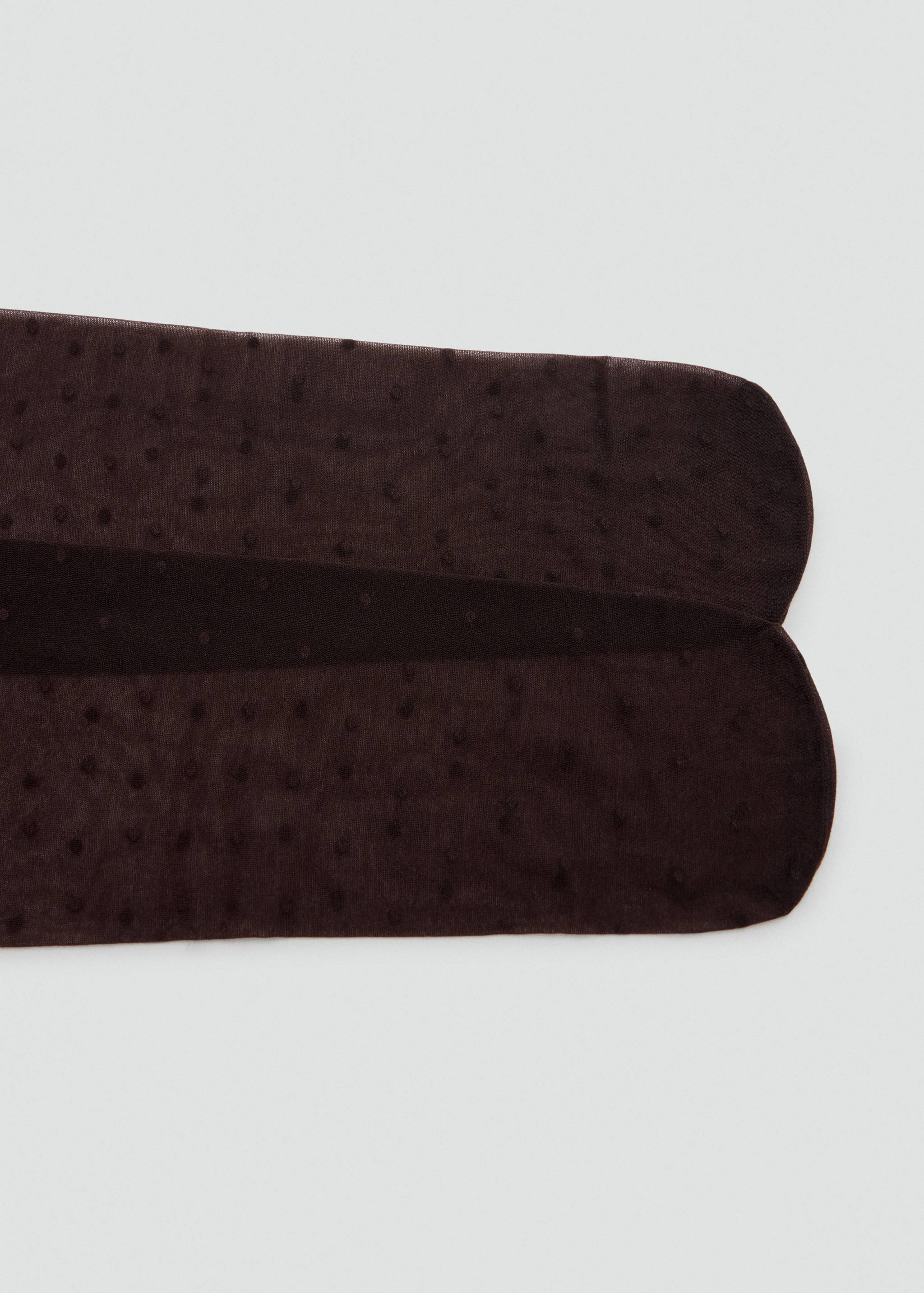 Dark brown sheer tights with a plumeti dot pattern.