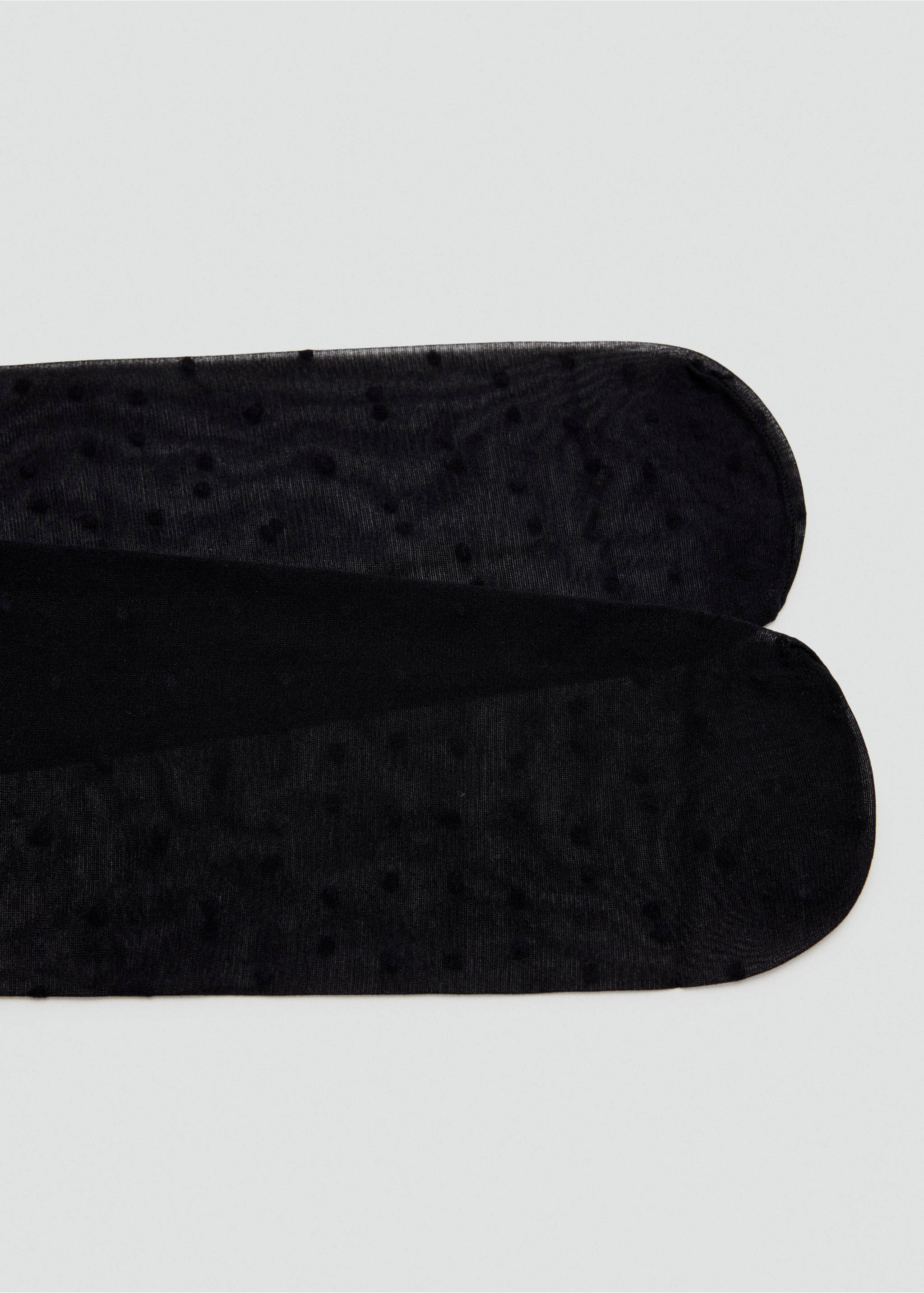 Black sheer plumeti dot tights in a close-up accessory view., Black. Ref: 47041375-00.