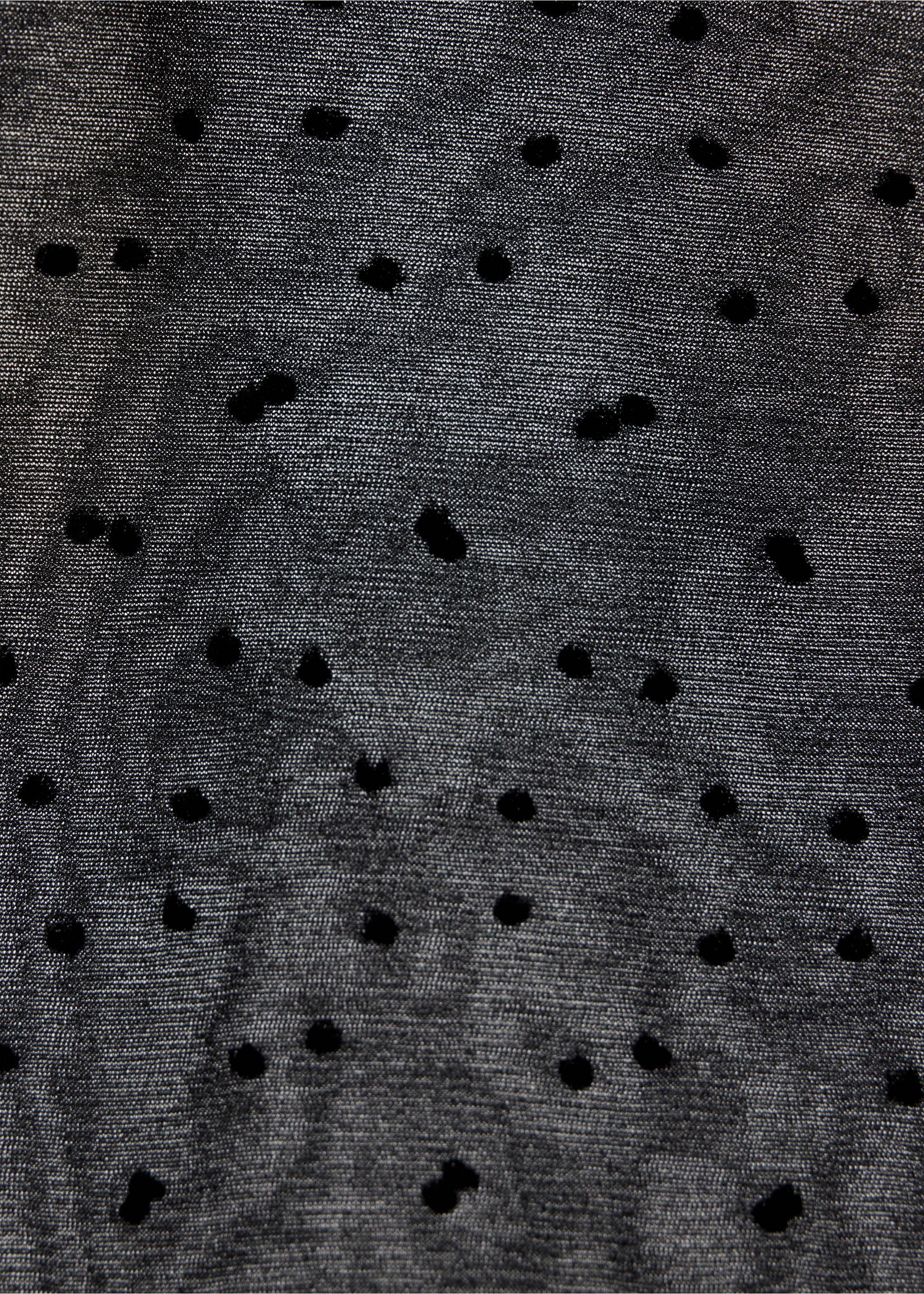 Close-up of sheer black tights with a polka-dot plumeti pattern., Black. Ref: 47041375-00.