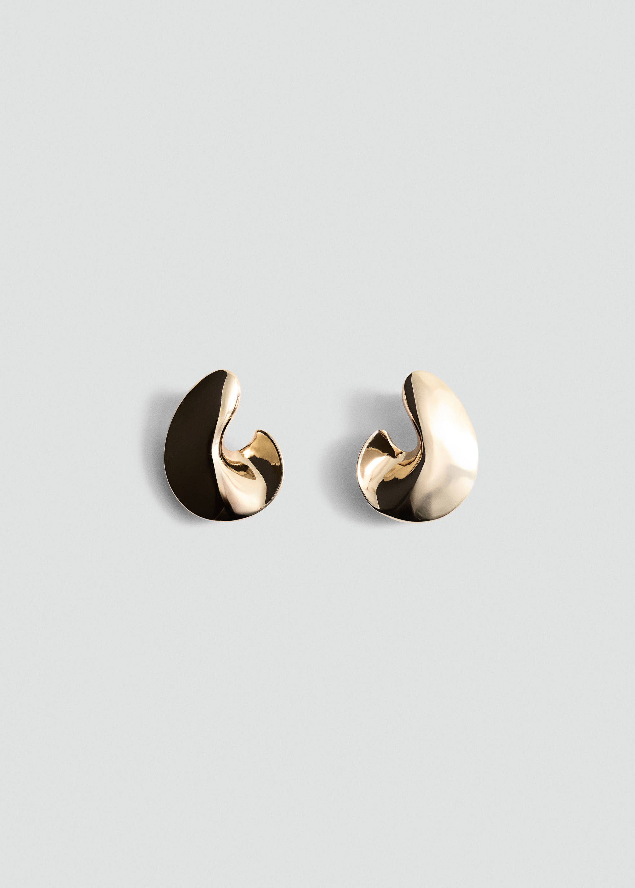 Polished gold-coloured asymmetric sculpted earrings.