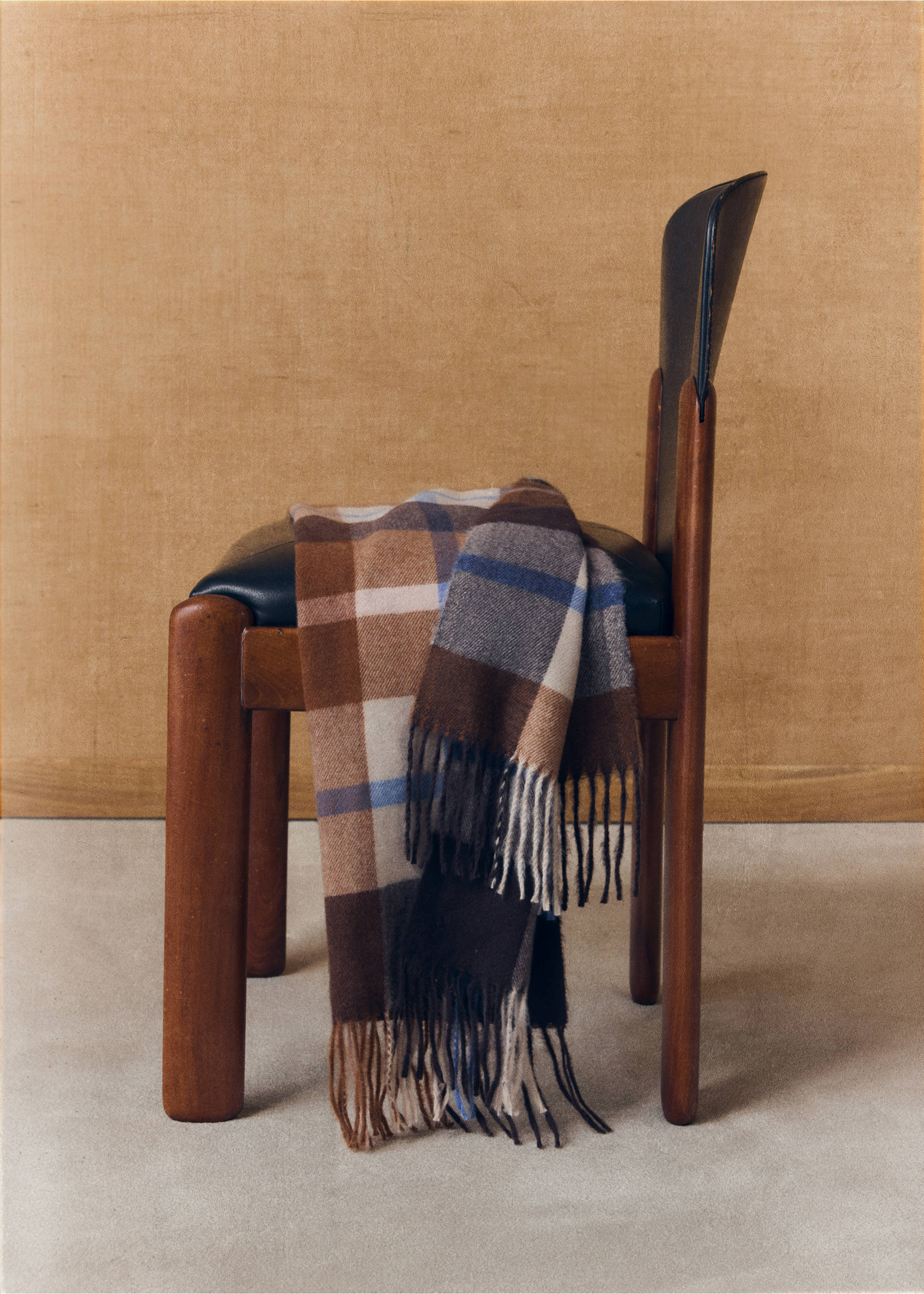 Brown, cream, grey, and blue checkered scarf with fringe, displayed on a chair., Brown. Ref: 47041409-00.