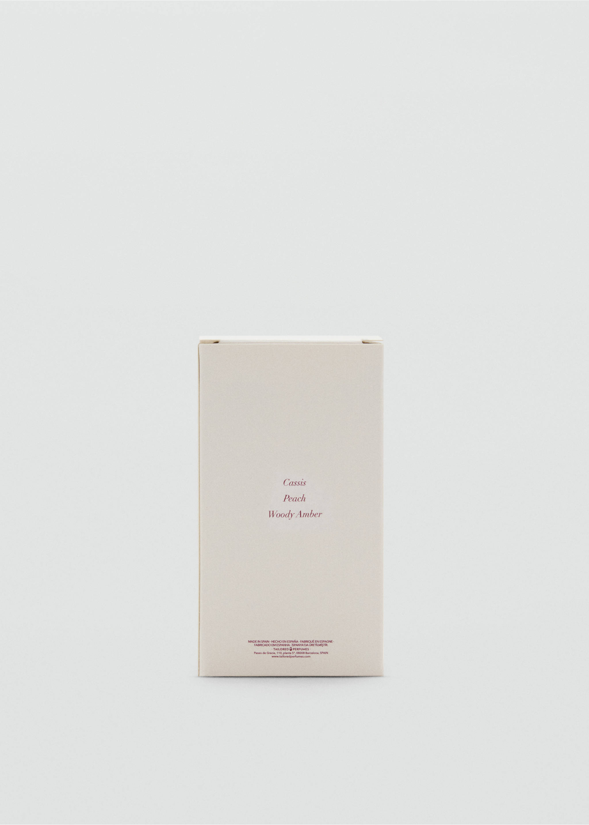 Light beige perfume box with Cassis, Peach, and Woody Amber text., Mink Grey. Ref: 47051334-00.