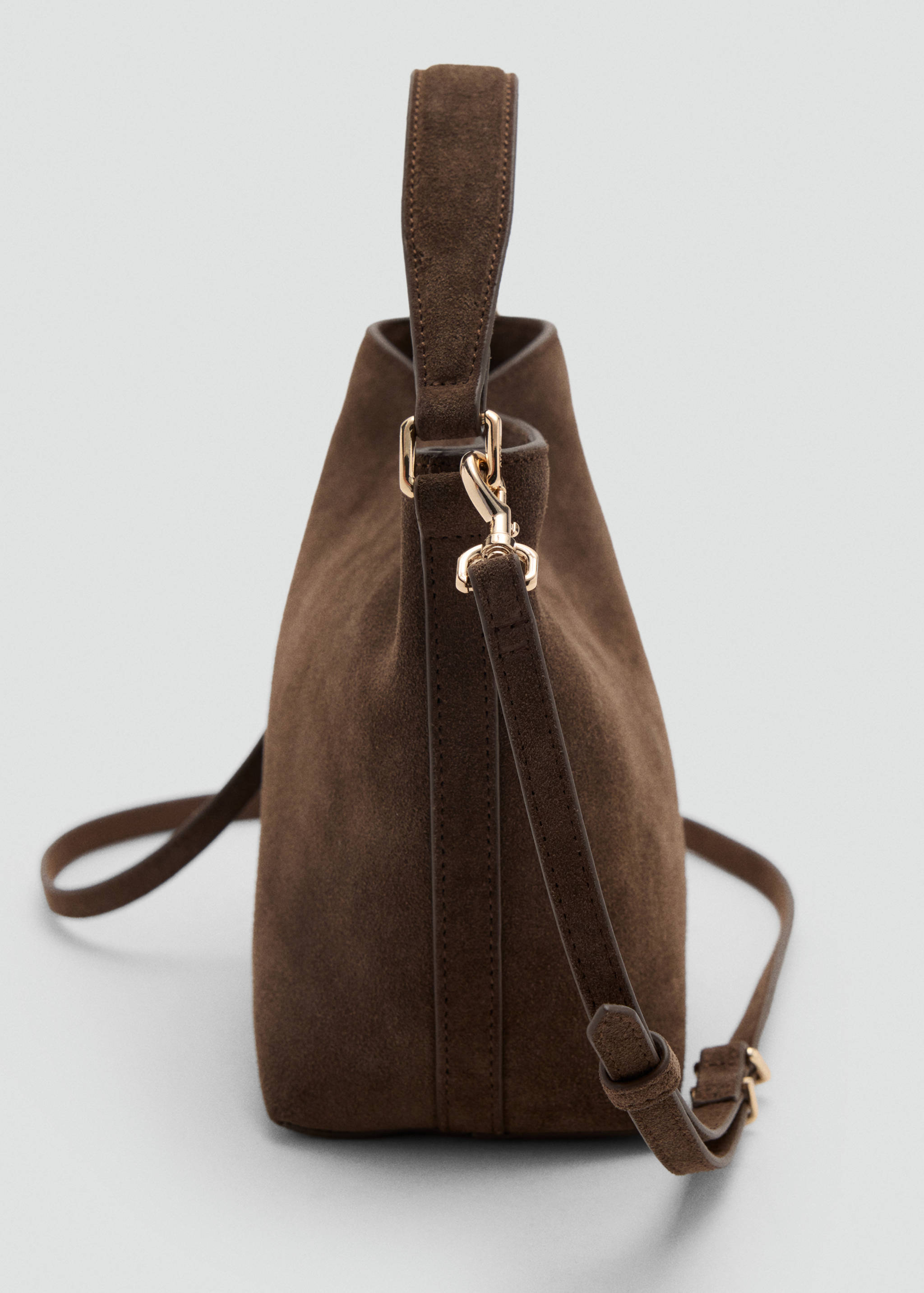 Brown suede bucket bag, side detail.