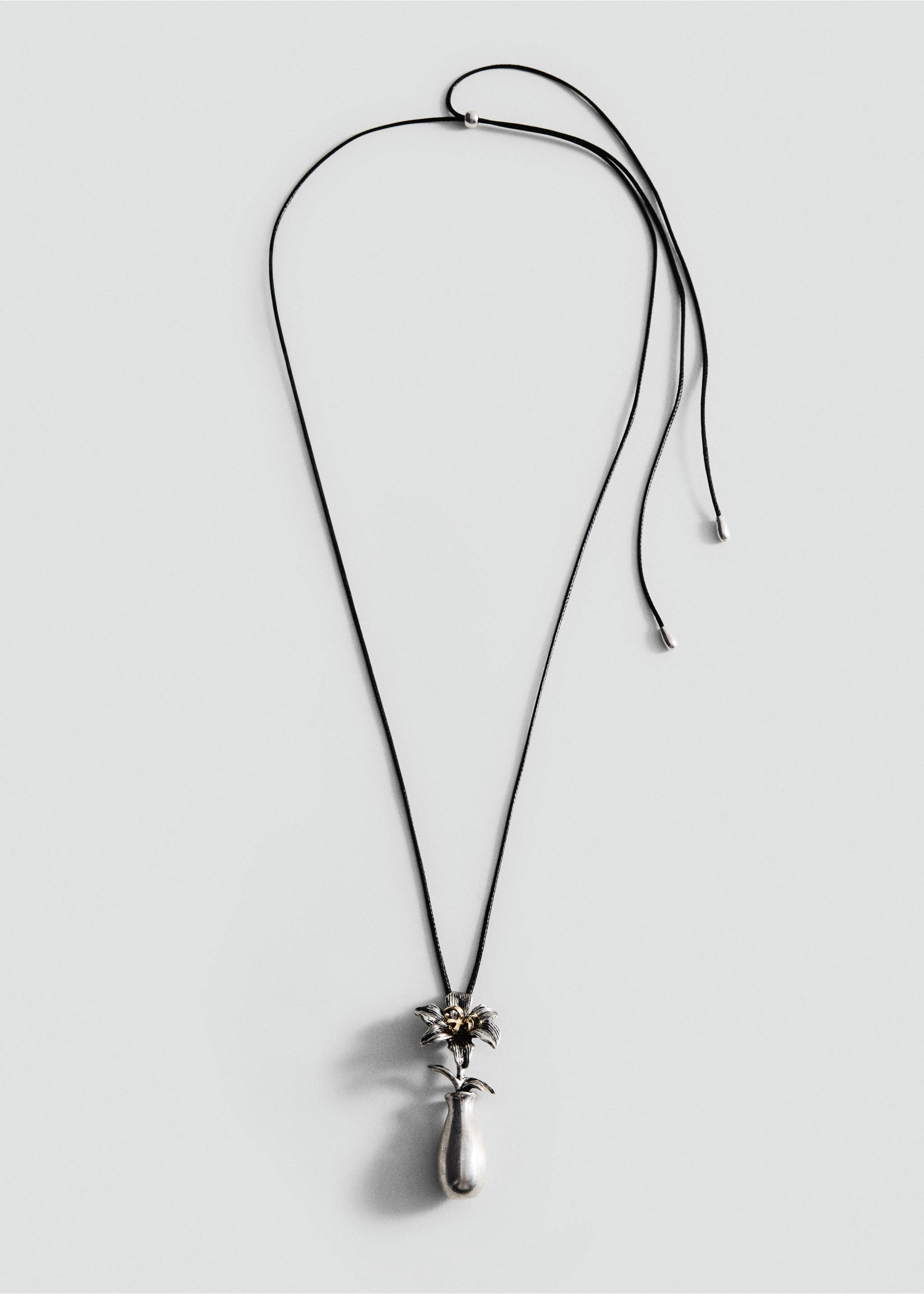 Long black cord necklace with a silver vase and flower pendant., Silver. Ref: 47051383-00.