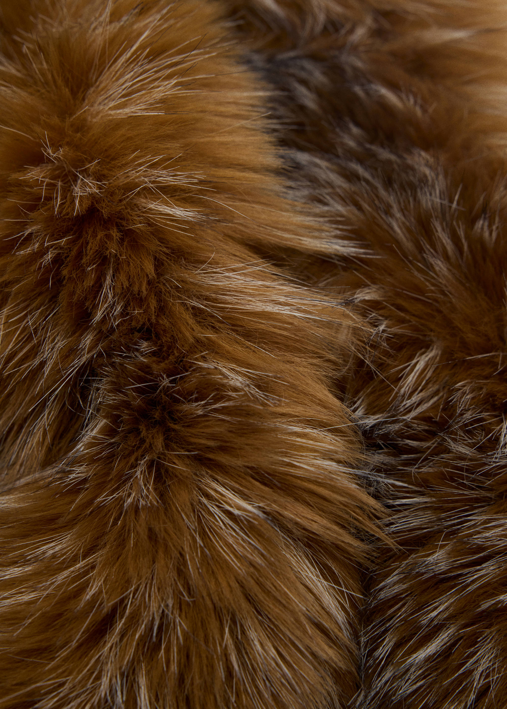 Brown faux-fur scarf close-up.