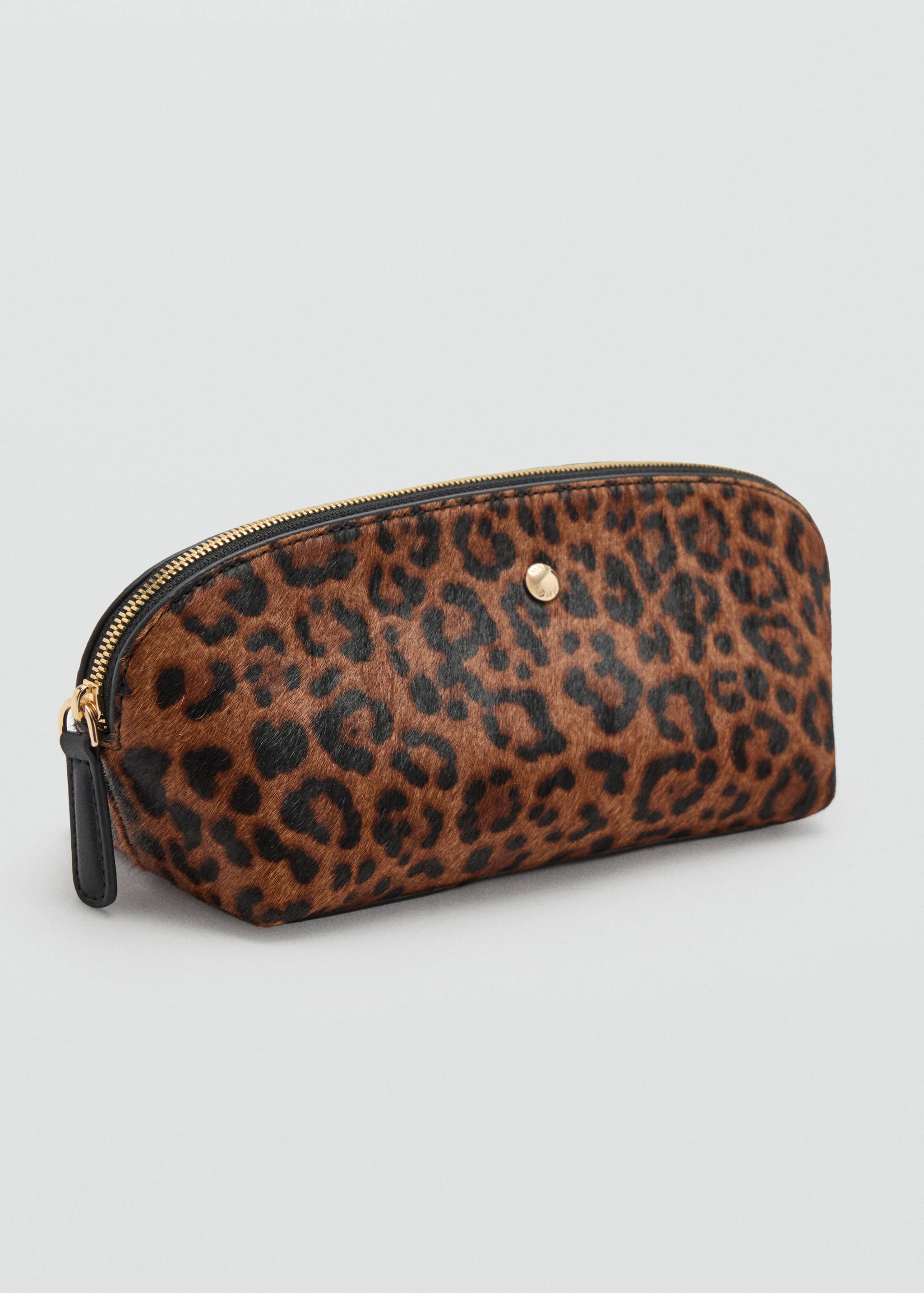 Leopard print faux-fur cosmetic bag with a zip closure.
