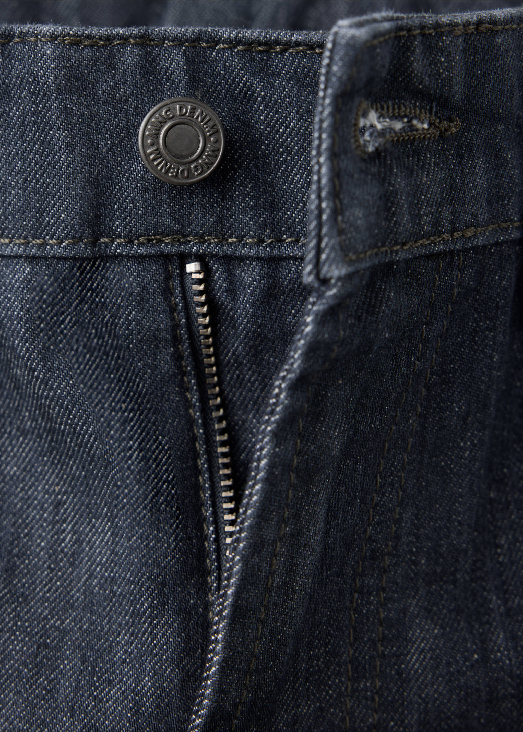 Dark blue denim trousers detail showing the button and zipped fly., Denim Grey. Ref: 47061400-00.