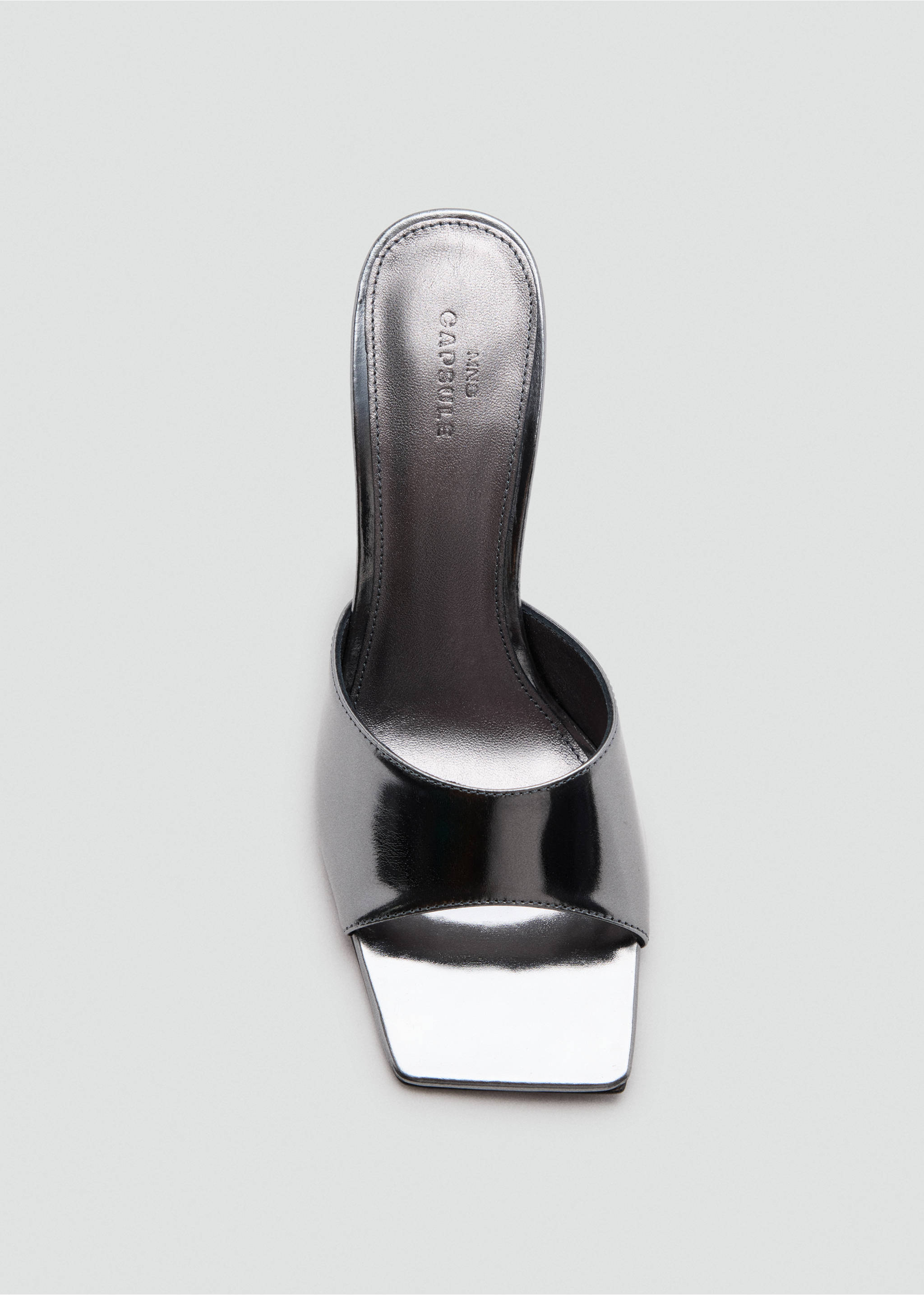Close-up of a metallic silver heeled sandal with a wide strap and squared toe., Dark Silver. Ref: 47061482-00.