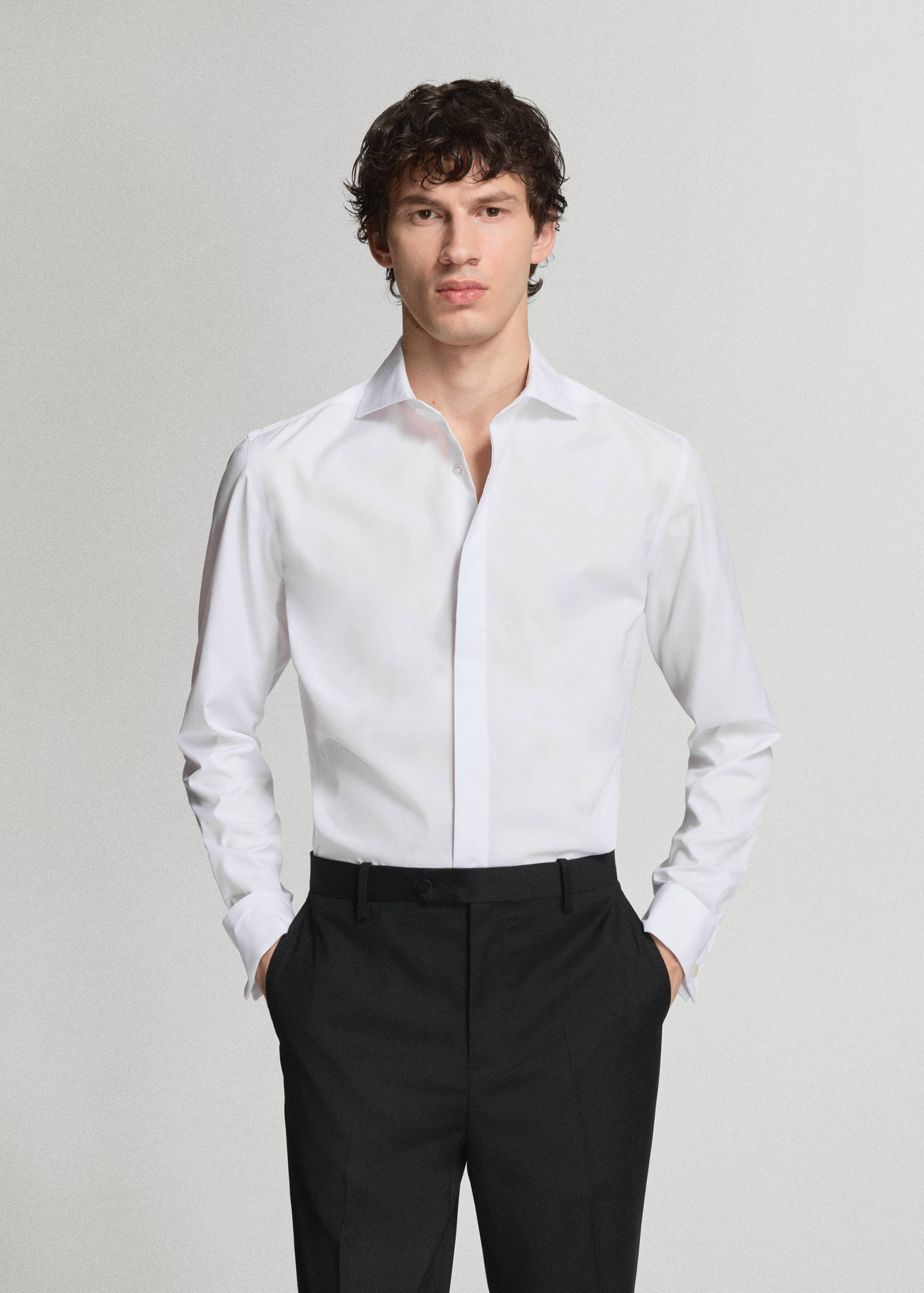White long-sleeved dress shirt with a classic collar and cuffs.