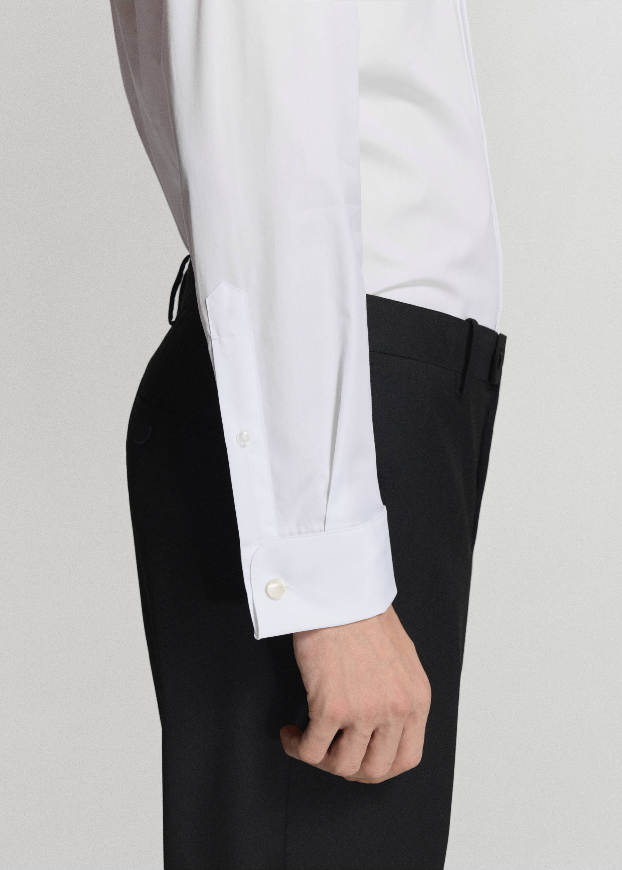 Close-up of a white shirt sleeve cuff on a model., White. Ref: 47071334-00.