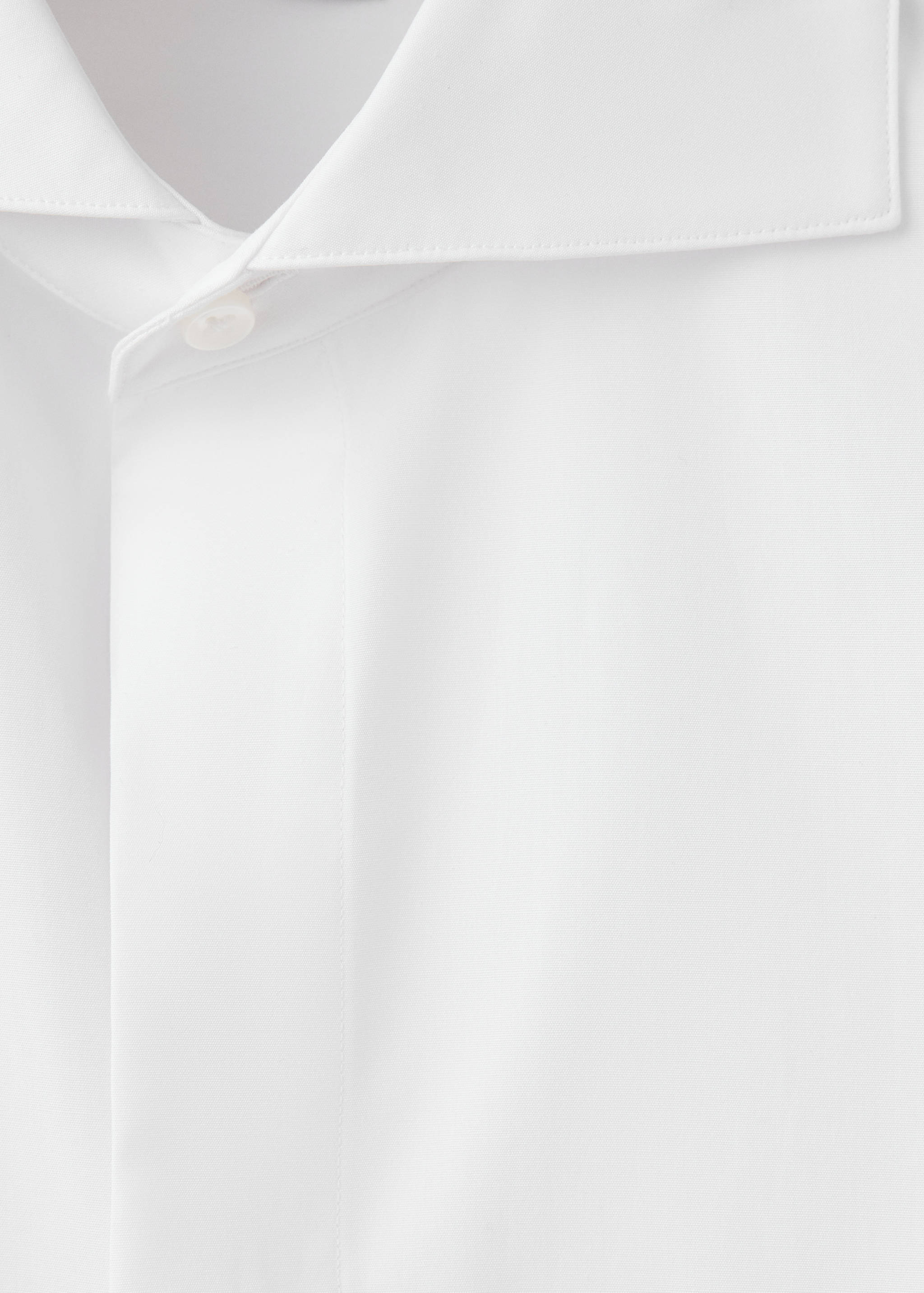 Close-up of a white men's shirt collar and button placket.