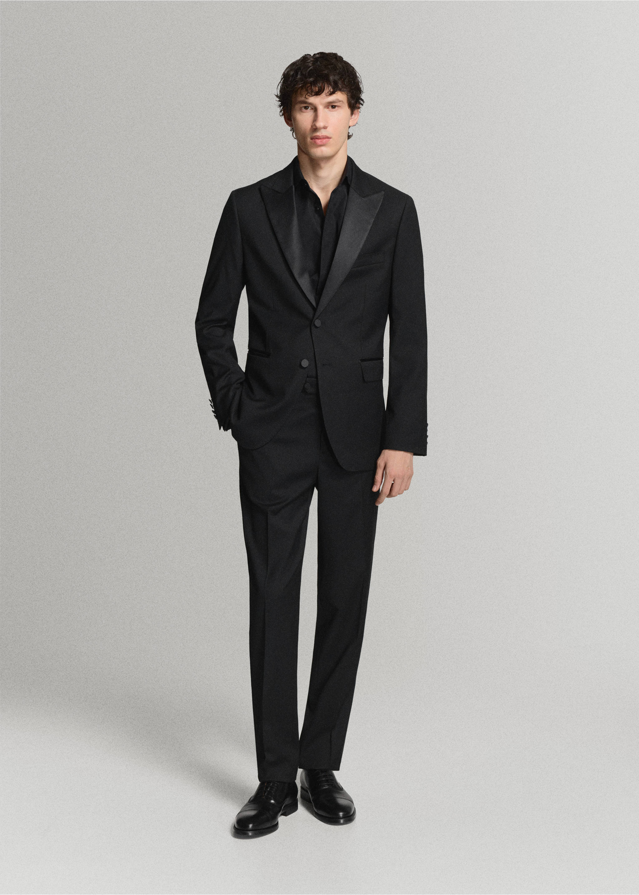 Black shirt worn under a tailored black suit with satin lapels, Black. Ref: 47071335-00.