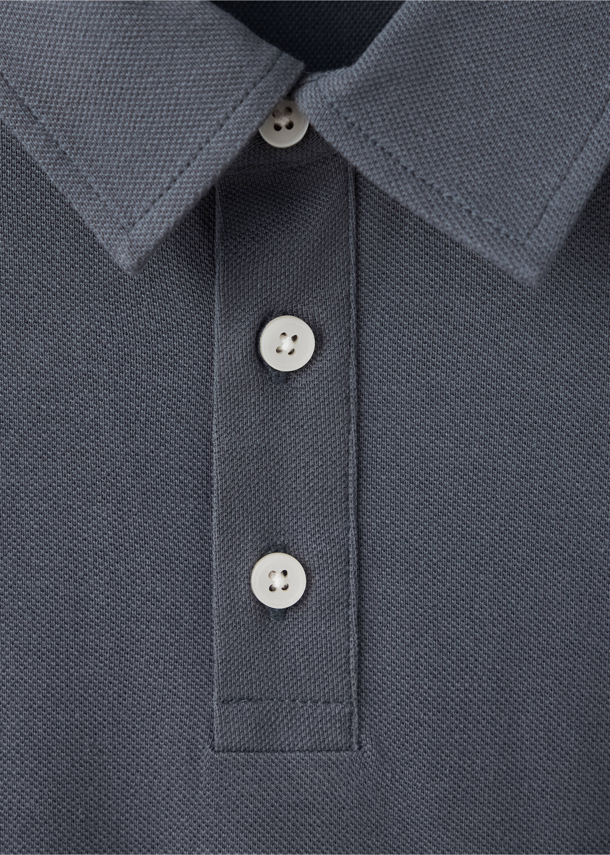 Close-up of a dark grey piqué polo shirt collar and button placket., Grey. Ref: 47071338-00.