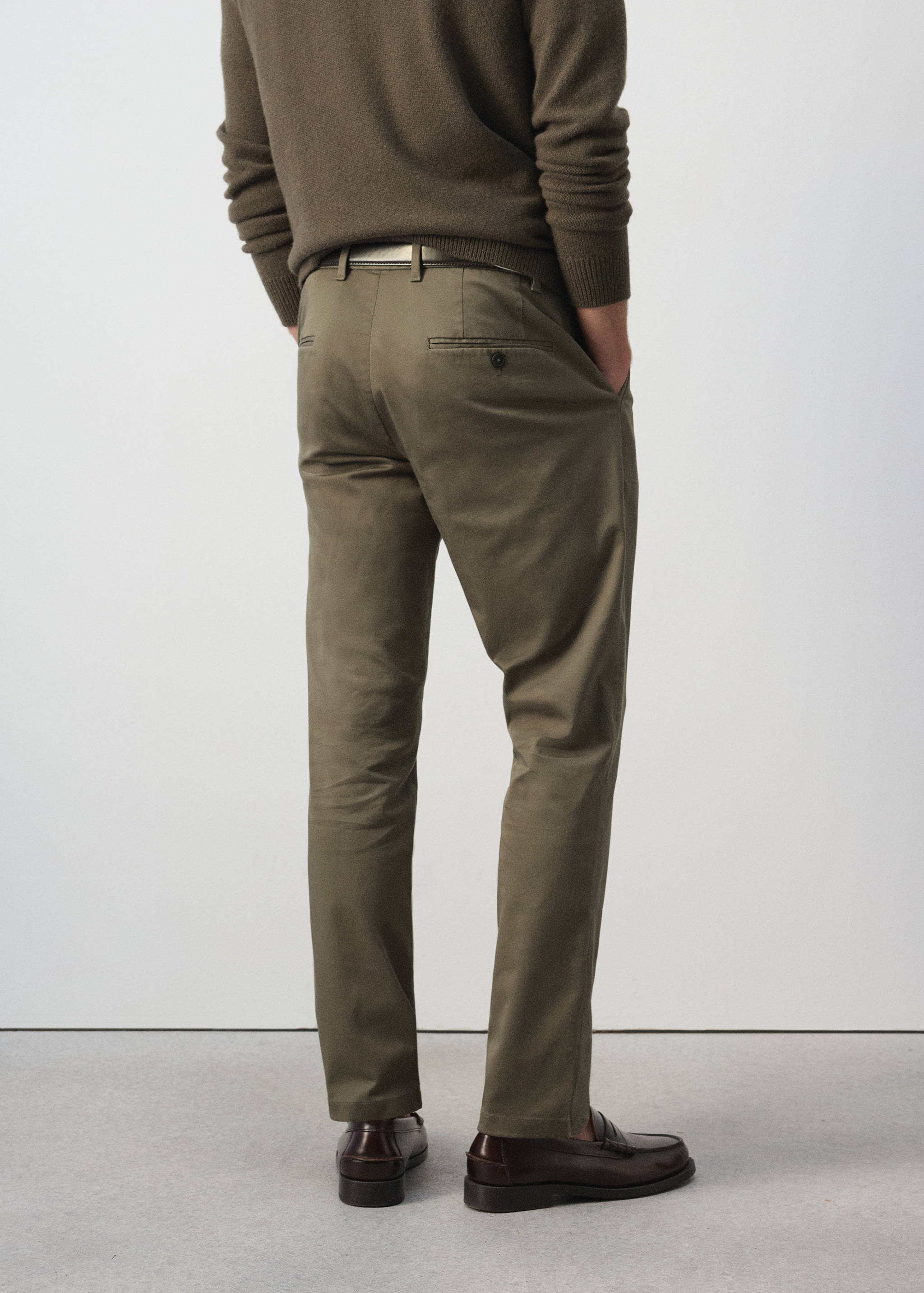 Olive green trousers, back view
