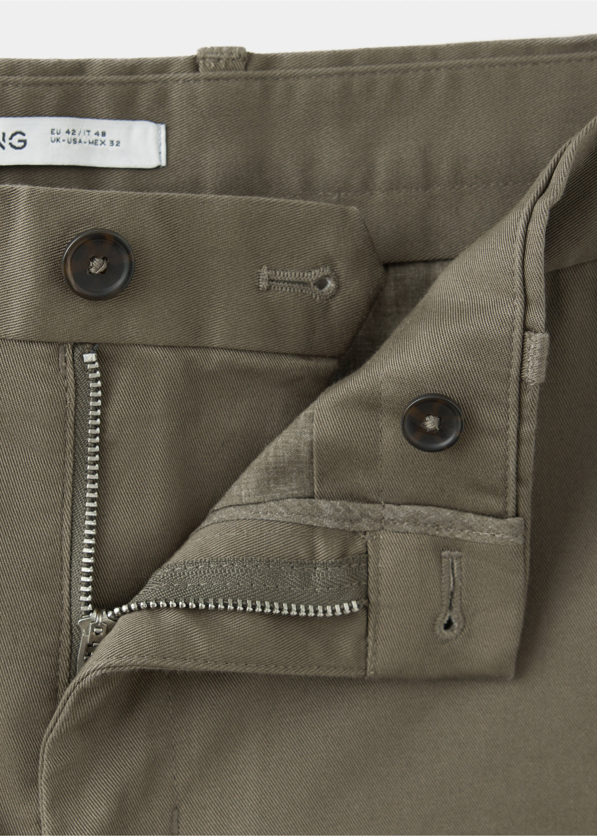 Close-up of khaki green trousers, focusing on the waistband and fastening., Medium Brown. Ref: 47071351-00.