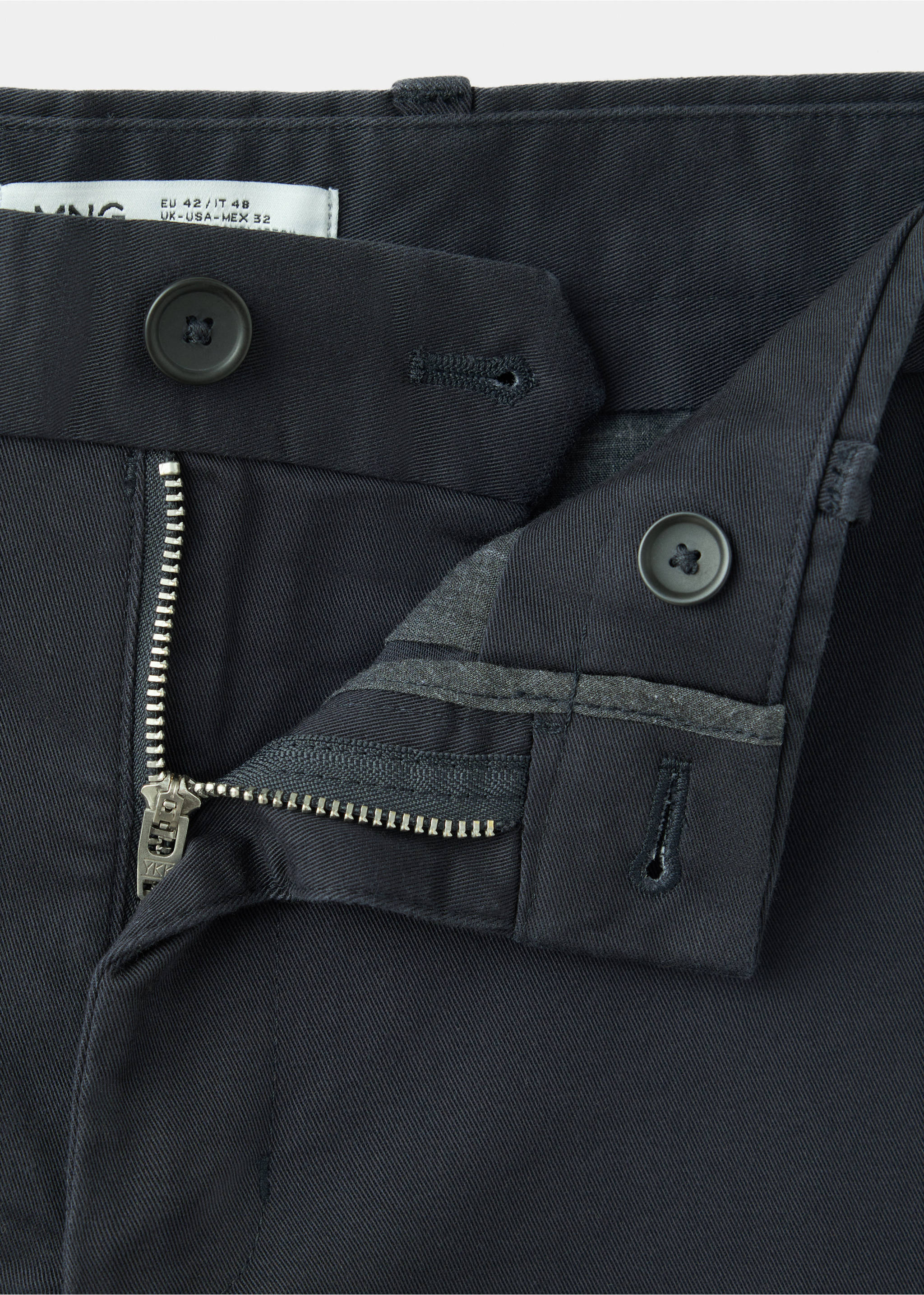 Close-up of the textured fabric and button fastening on dark grey trousers., Navy. Ref: 47071351-00.