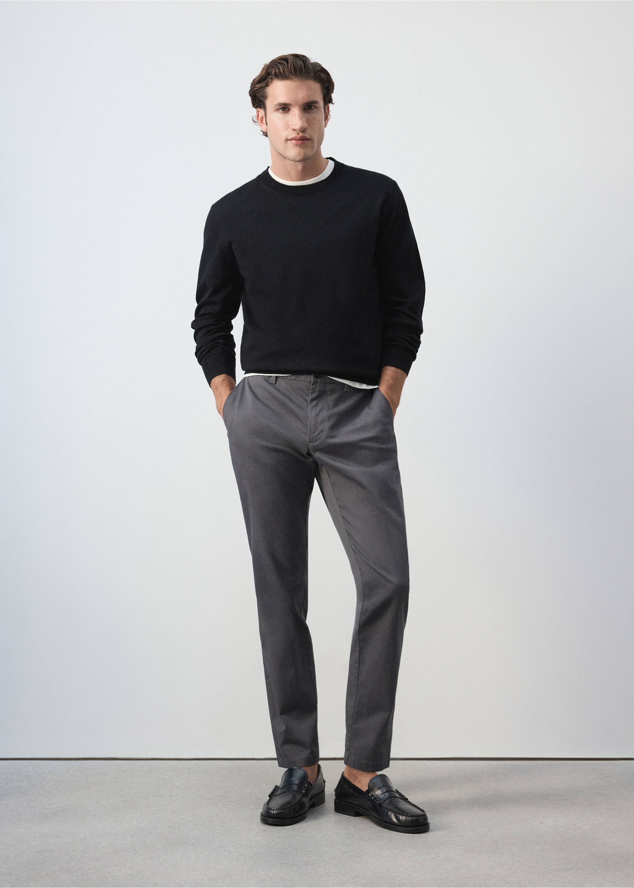 Grey slim-fit trousers worn with a black sweater., Medium Heather Grey. Ref: 47071351-00.