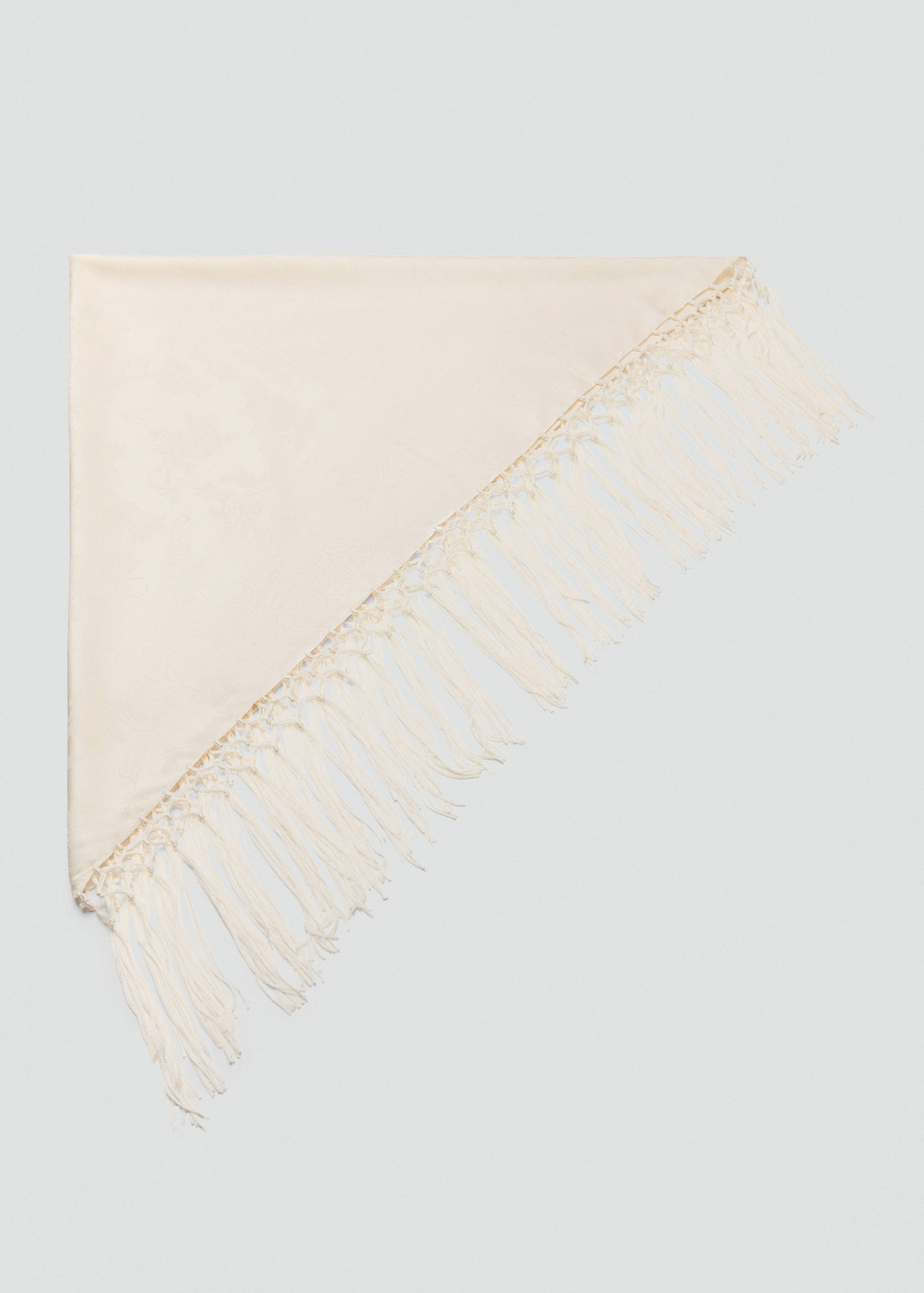 Cream triangular scarf with knotted fringe.