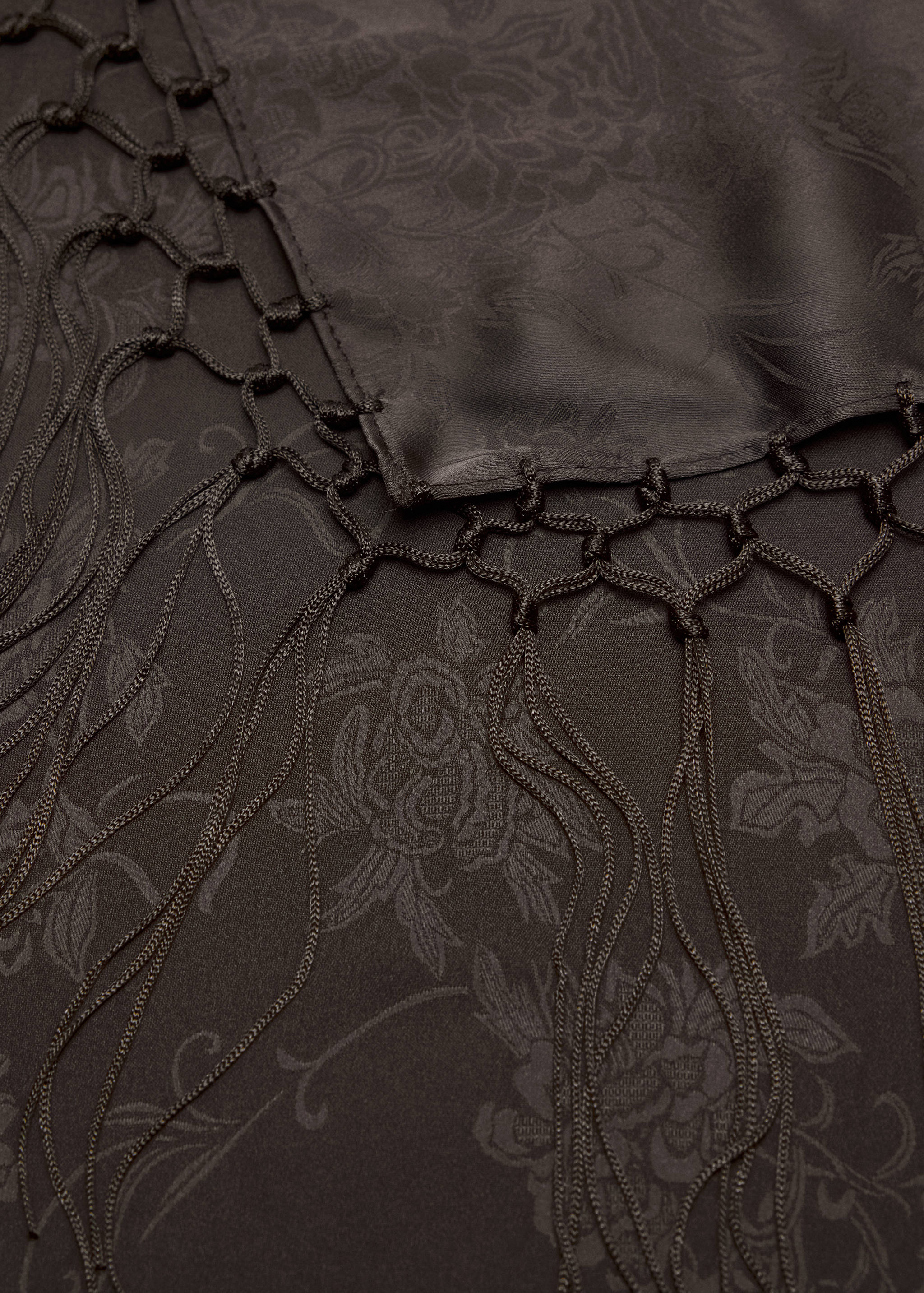Dark brown scarf with tonal floral jacquard and macramé fringe.